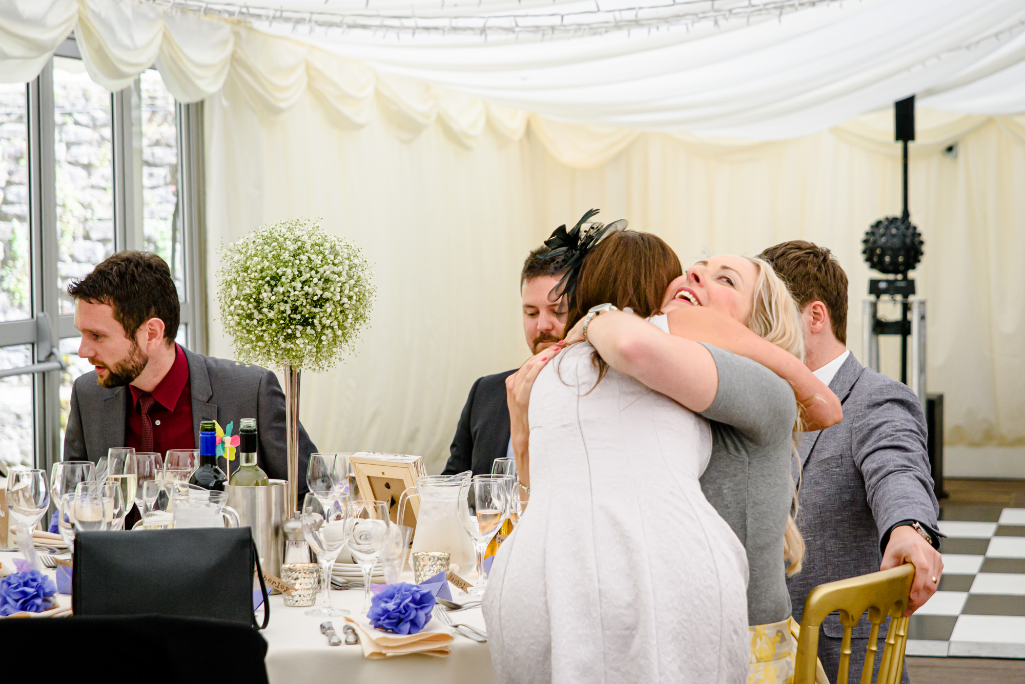 Wedding guests hugging