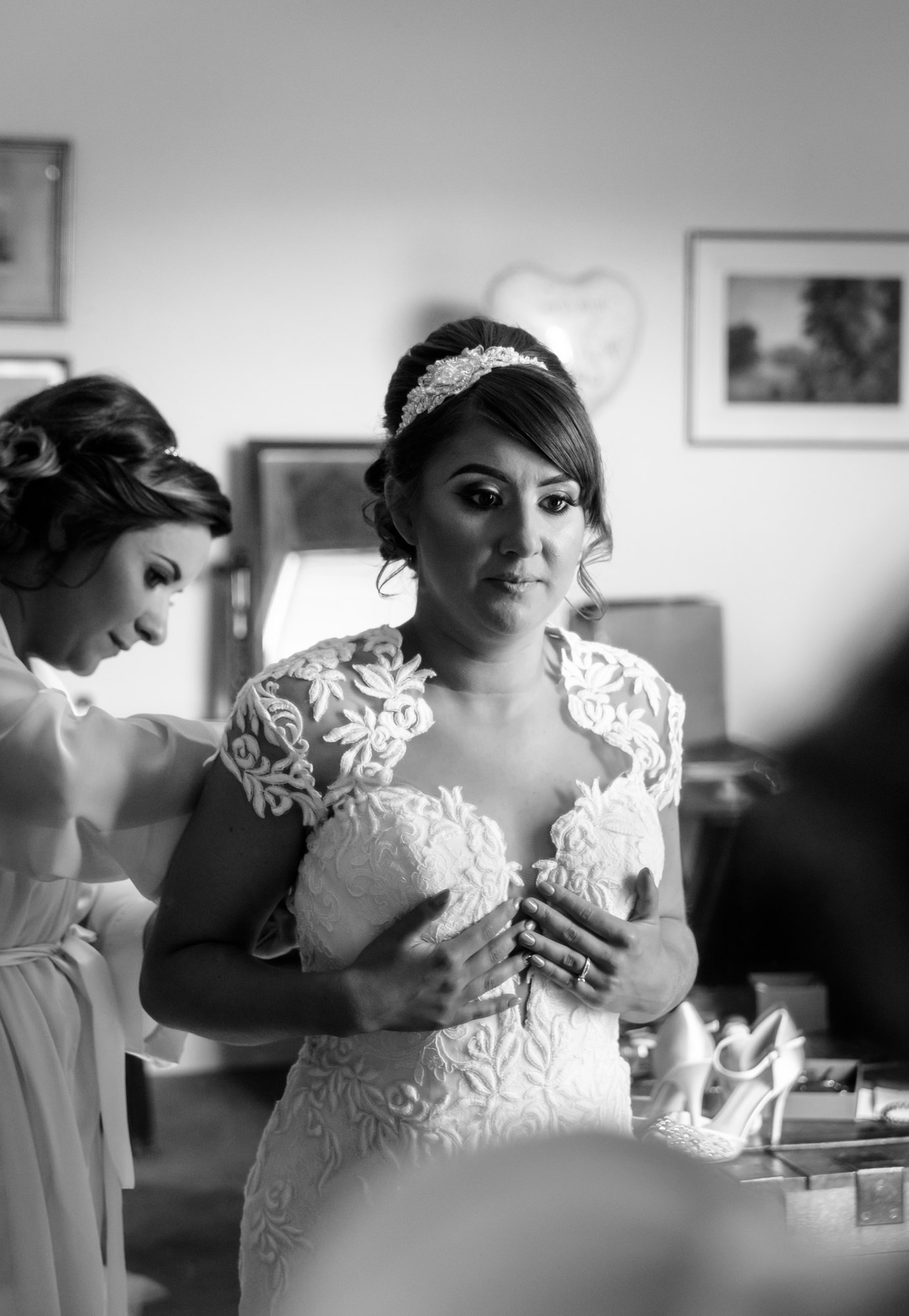 Bride getting ready at Bride dressing up her son at The inn at Whitewell