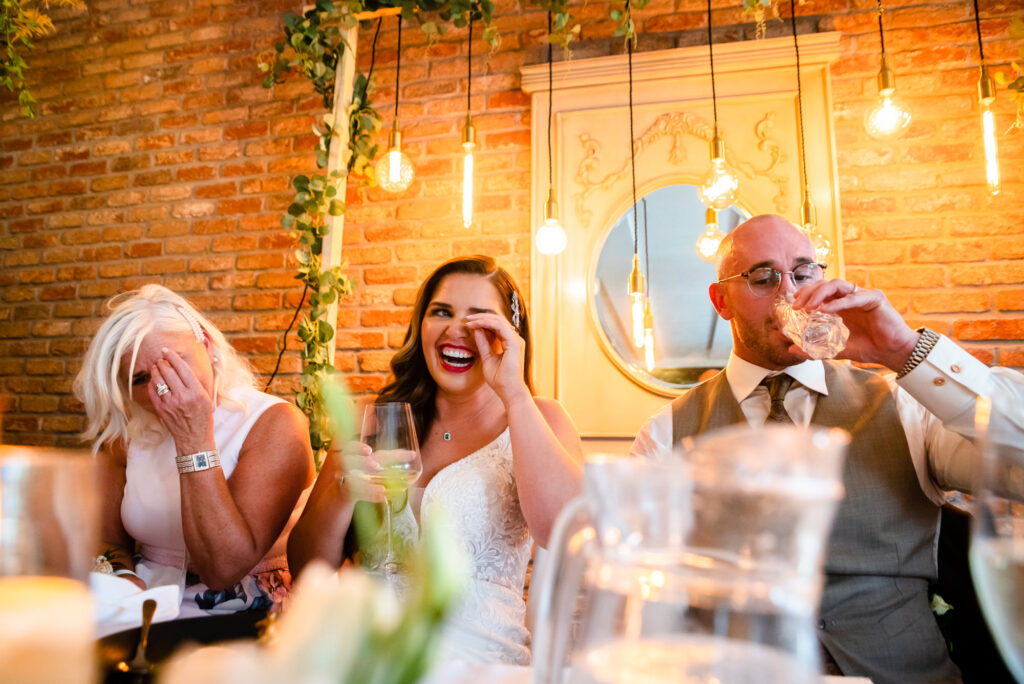 Bride laughing at speech