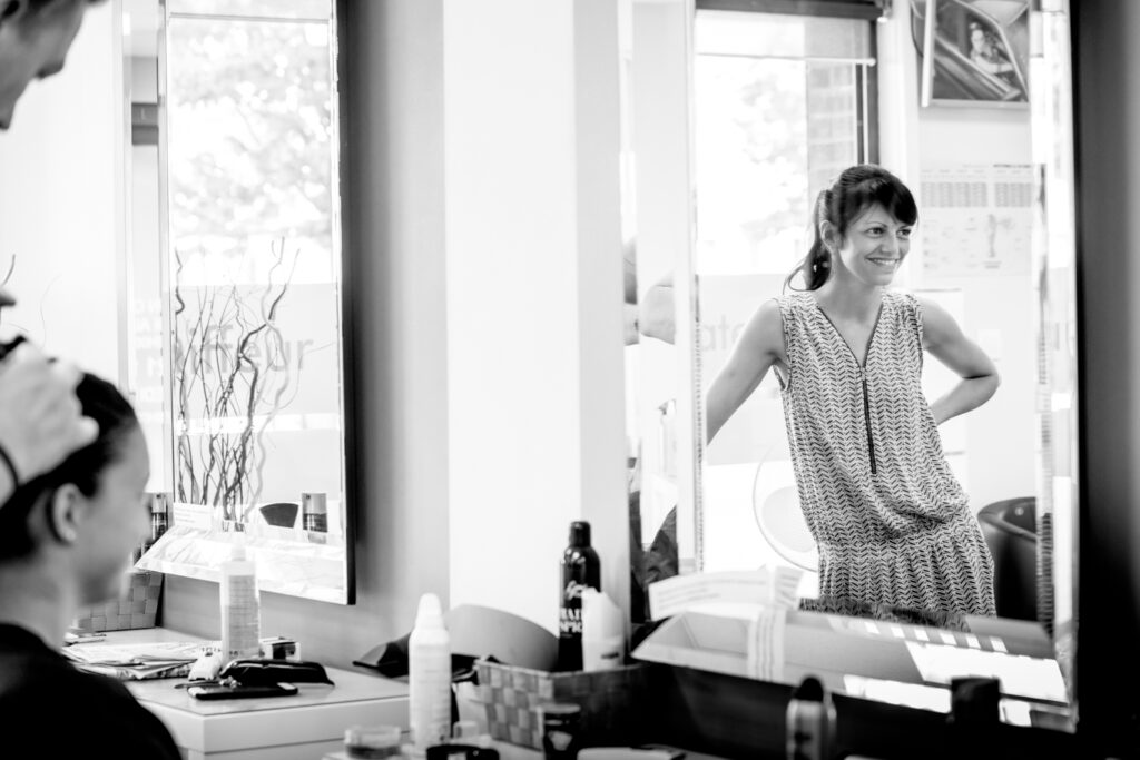 bride and sister at hairdresser