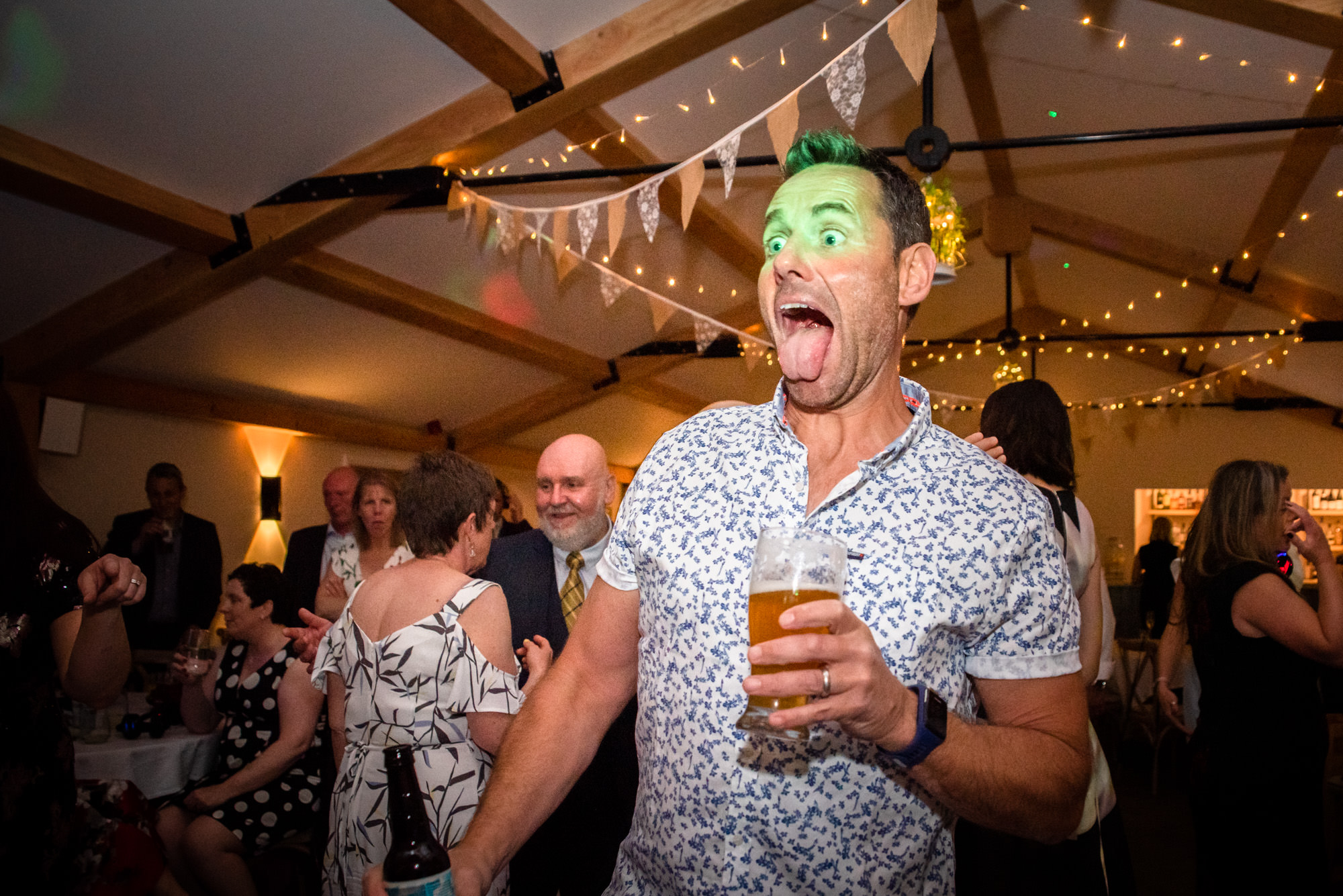 Guest pulling his tongue out on the dancefloor