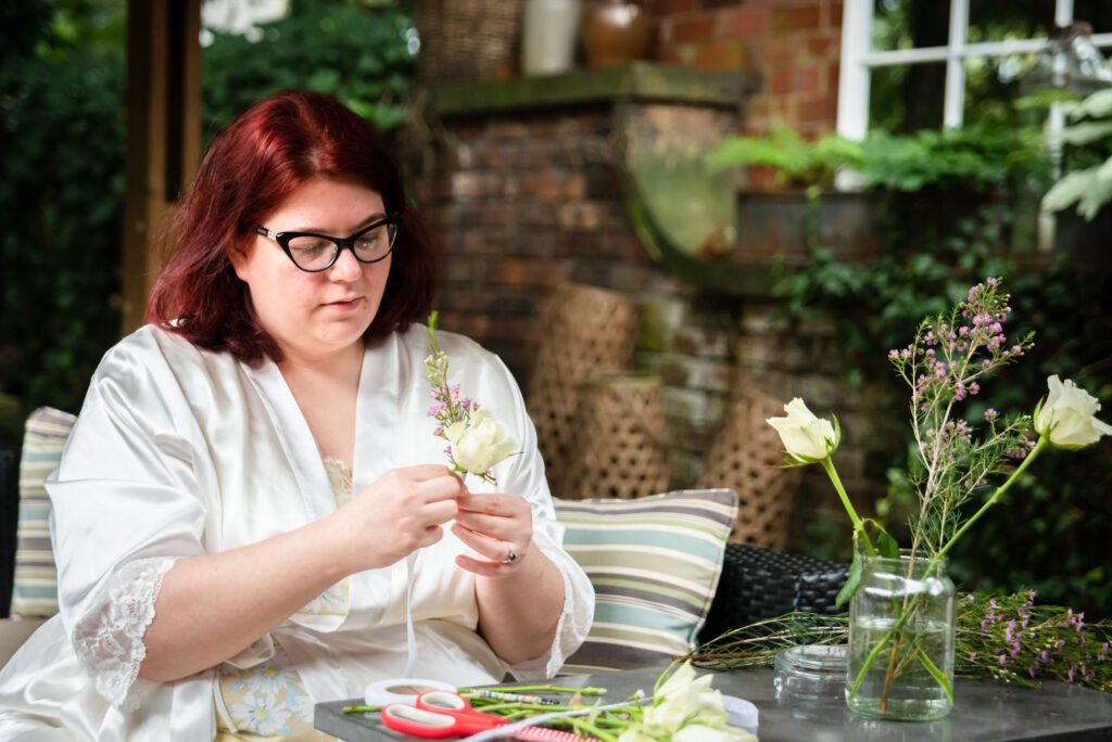 bride making buttonholes
