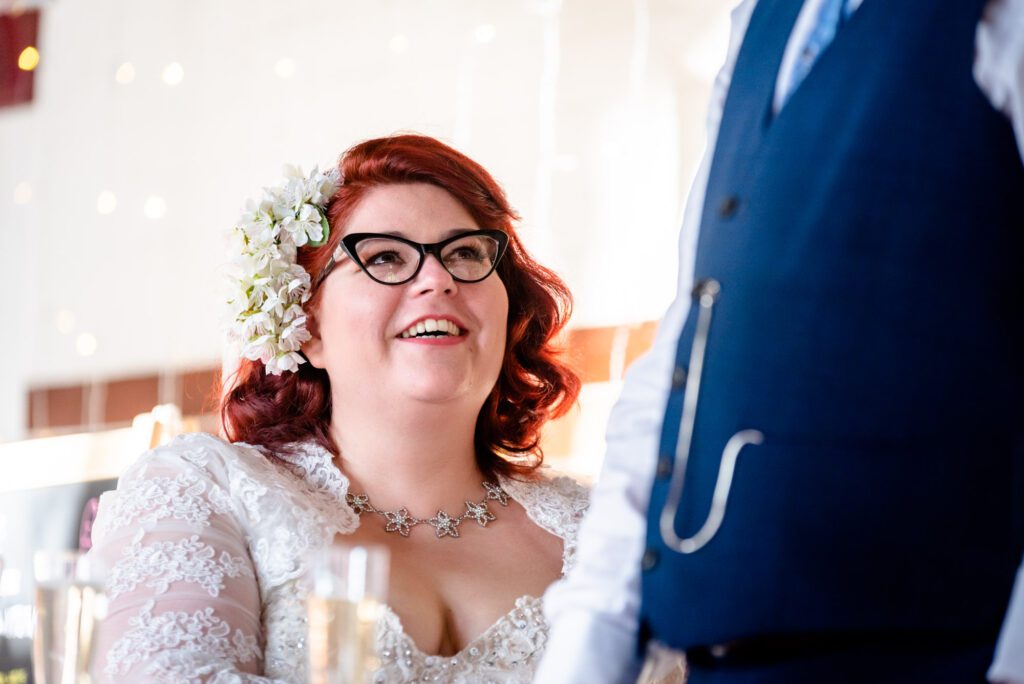 bride watching groom speech