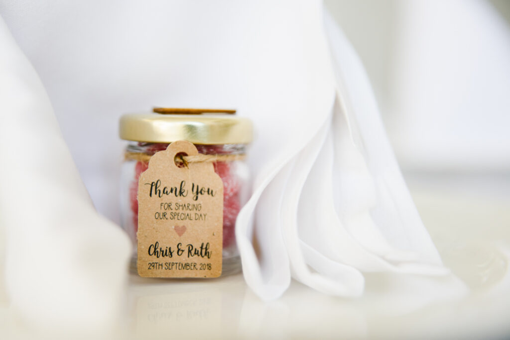 Handmade wedding favour using jam jars filled with sweets