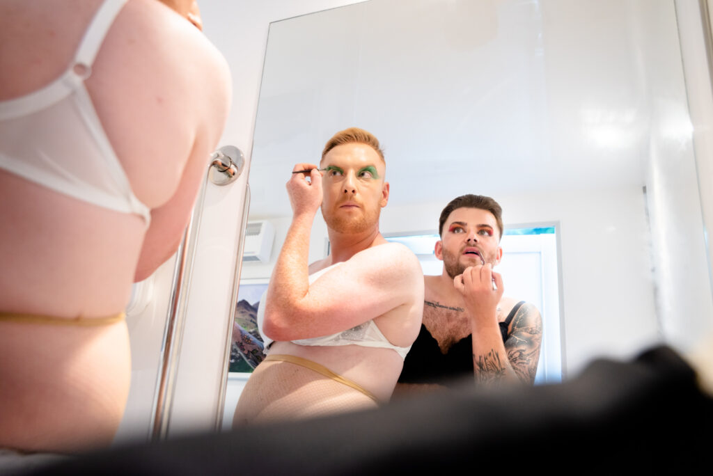 Grooms getting ready for their drag showThe First Dance at Gisburne Park Estate