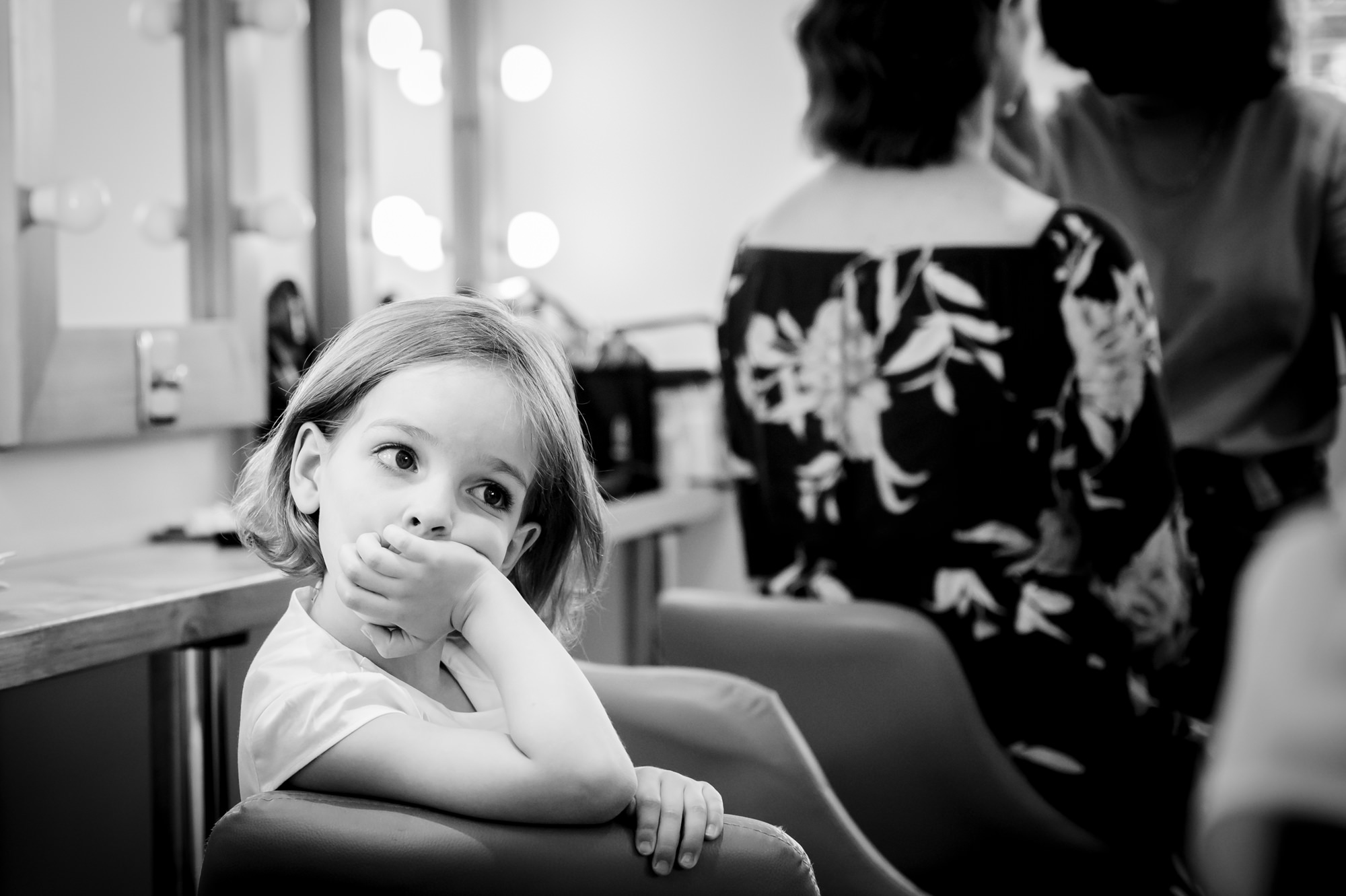 Little flower girl looking bored