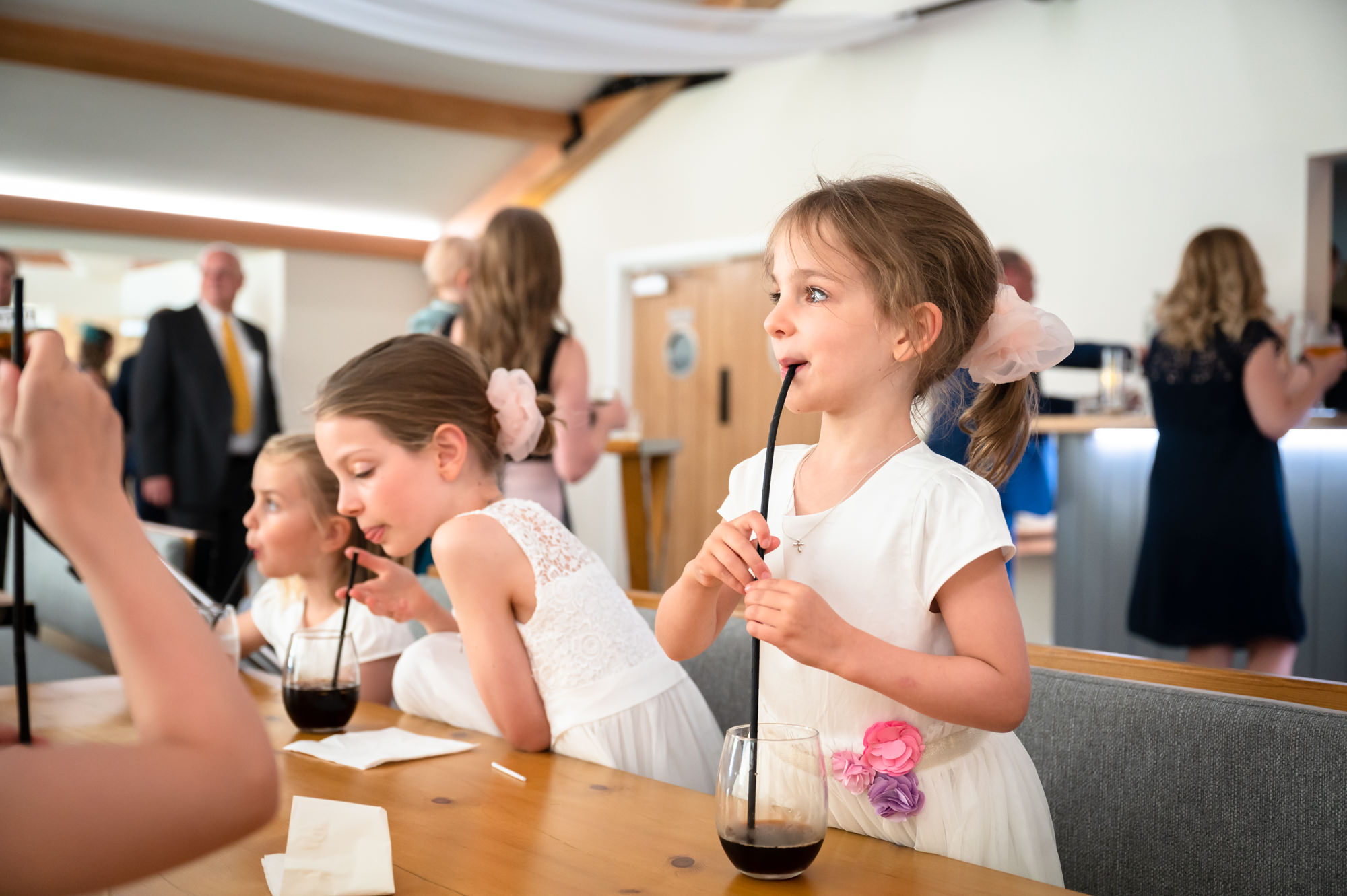 Flowergirls built an extra long straw to drink