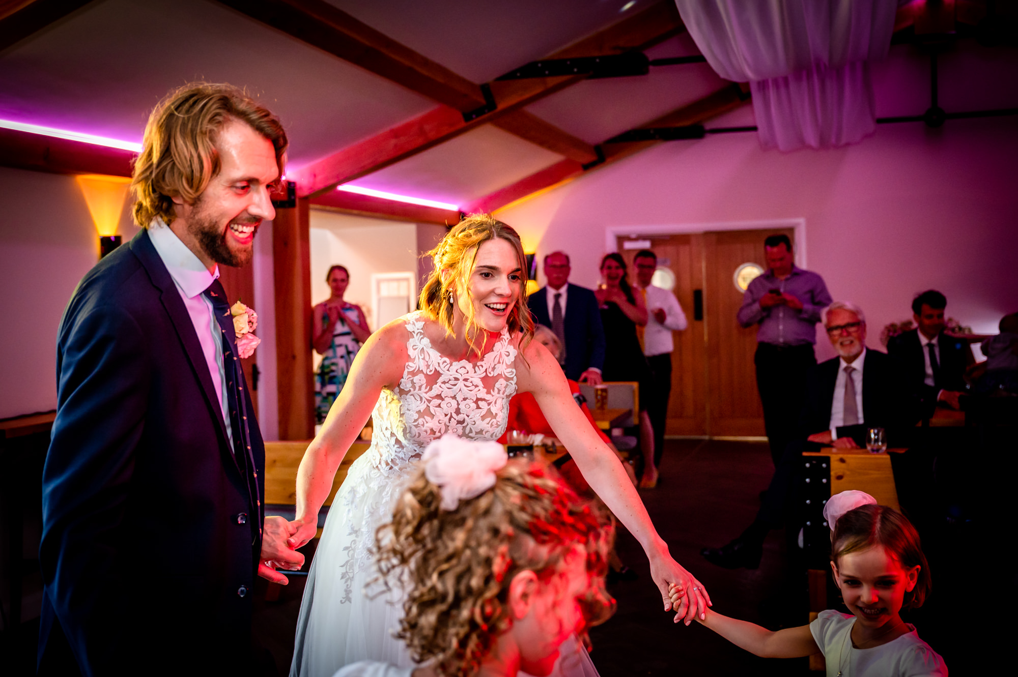 Flowers girls joining the bride and groom on the dancefloor at Hanbury Wedding Barn