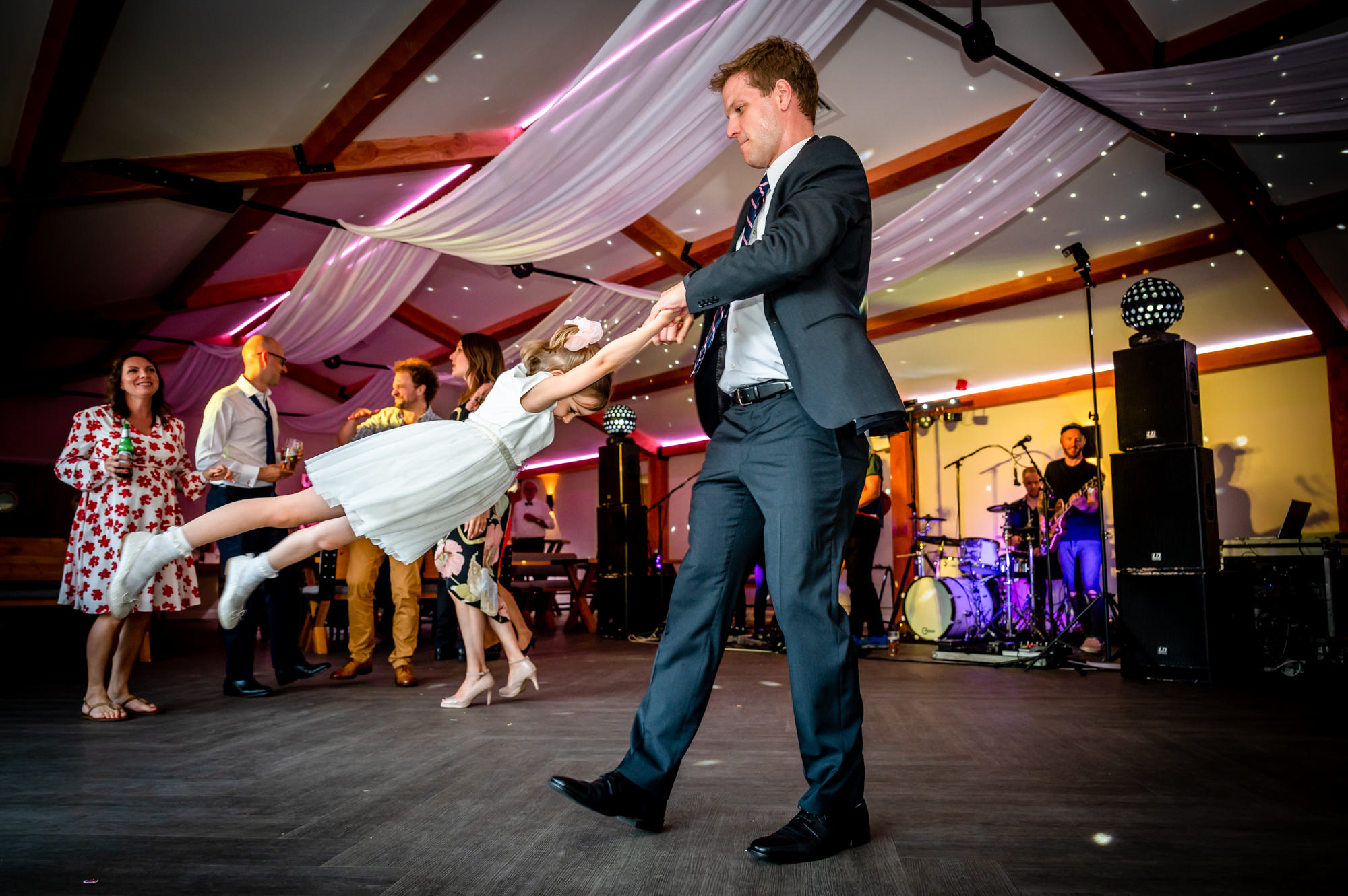 wedding guest spinning the flowergirl