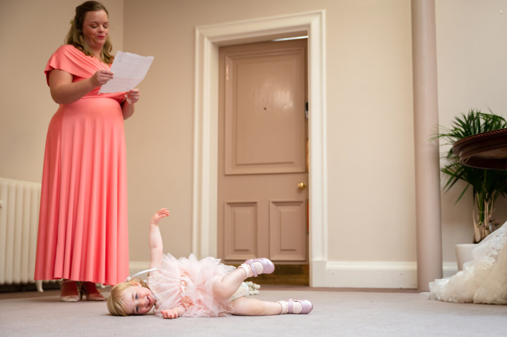 child lying down on the floor during the ceremony at Stockport town Hall