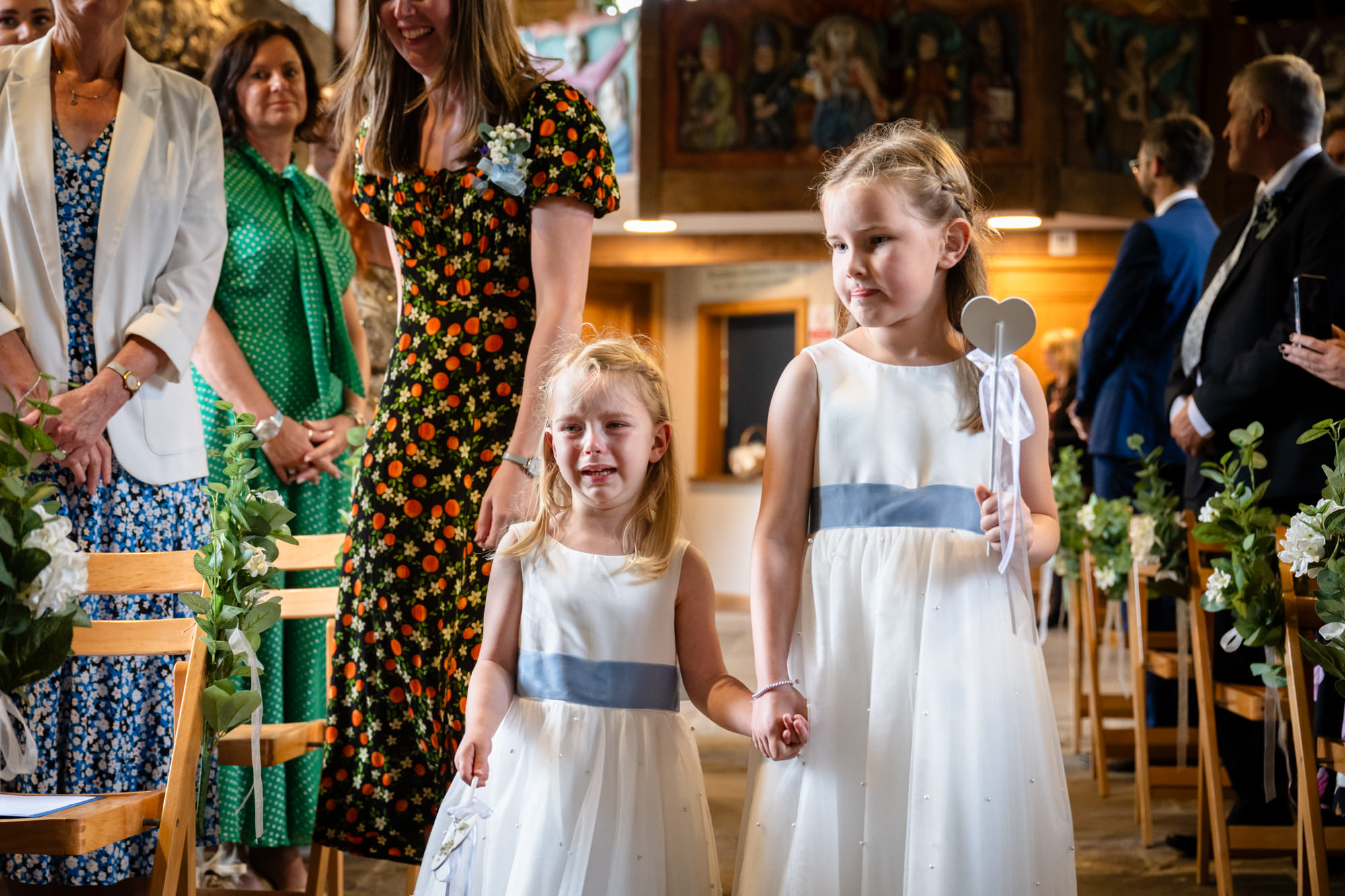 Flower girls crying whilst walking down the ailse at Chadkirk Chapel