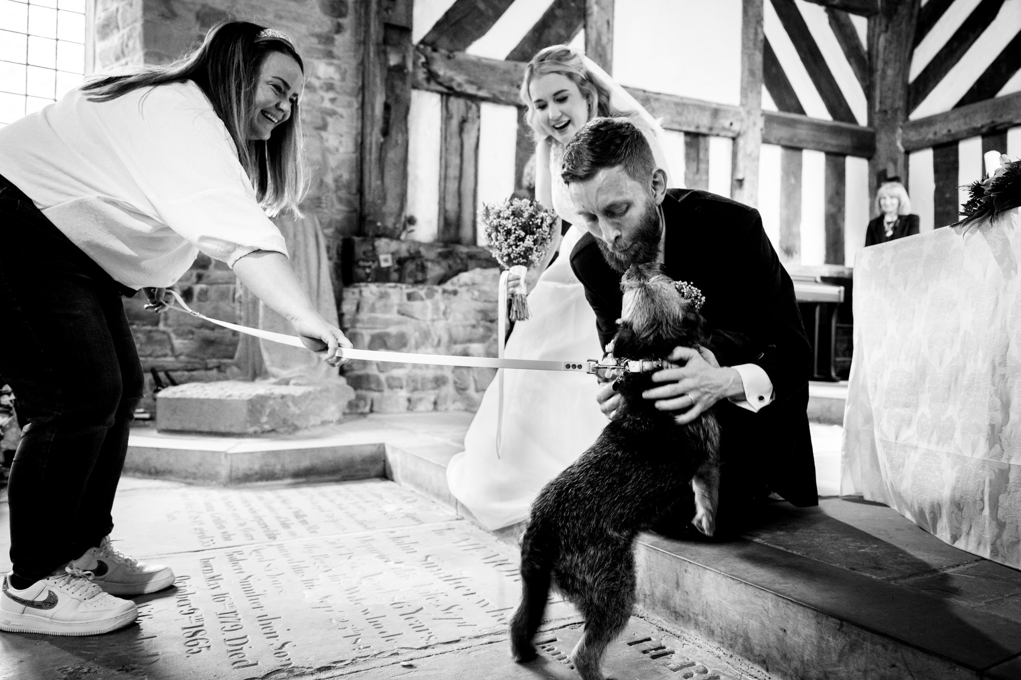 Groom says hello to his dog at Chadkirk Chapel