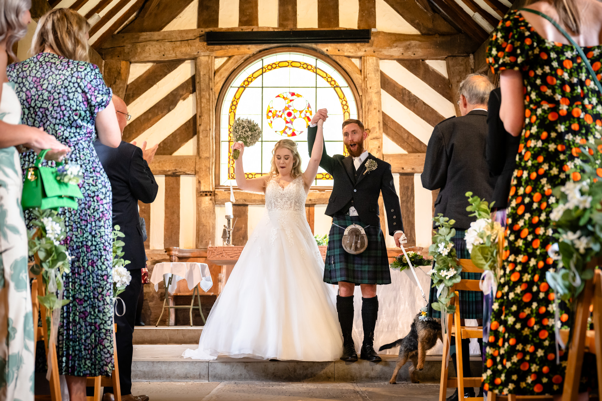 Bride and groom cheering