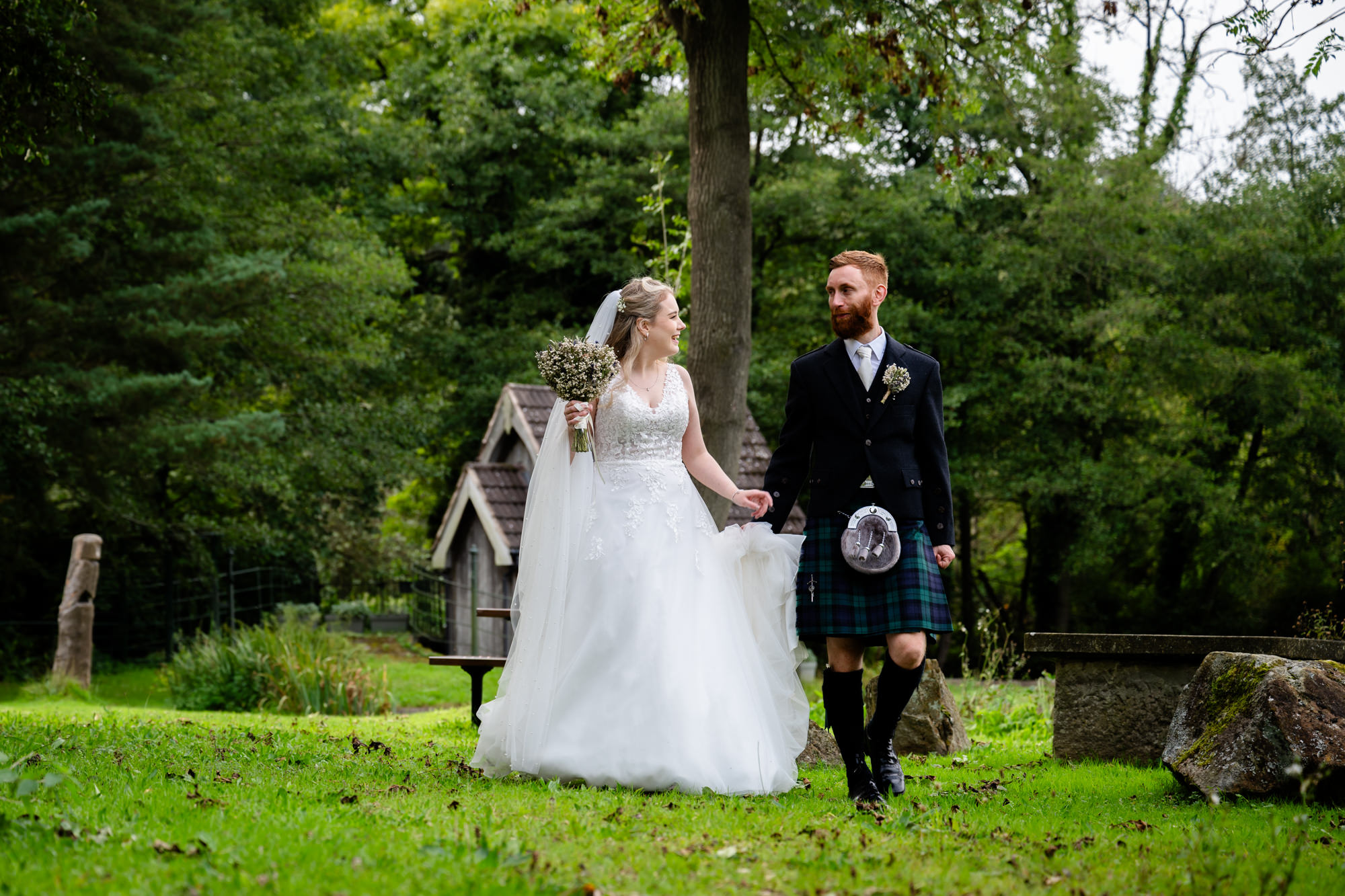 Bride and groom walking around The Roman Lakes