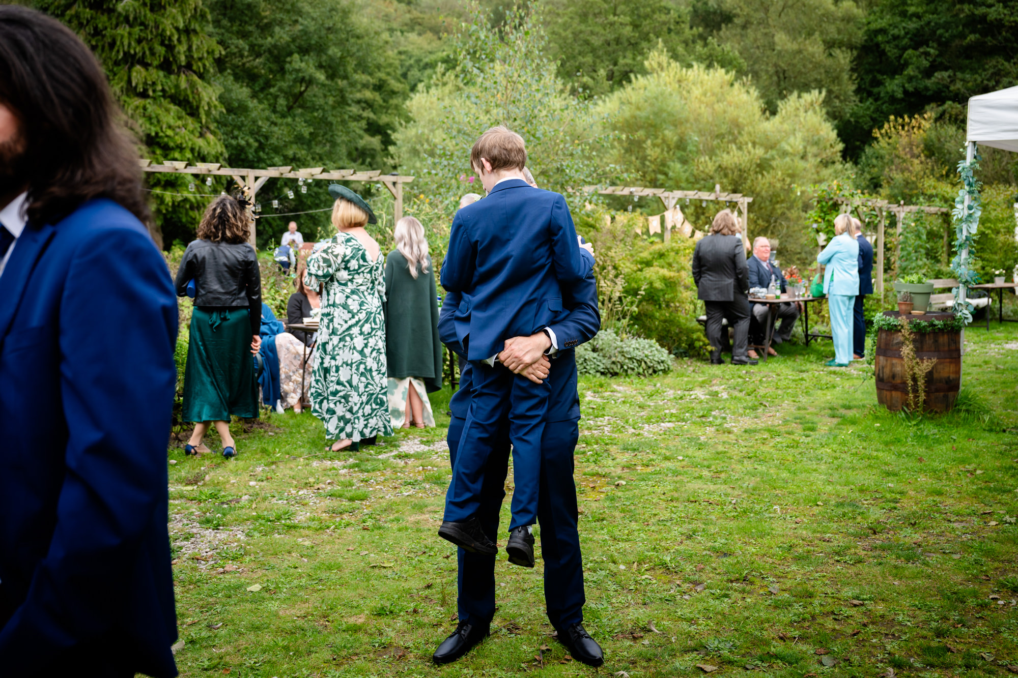 boy being arried at The Roman Lakes