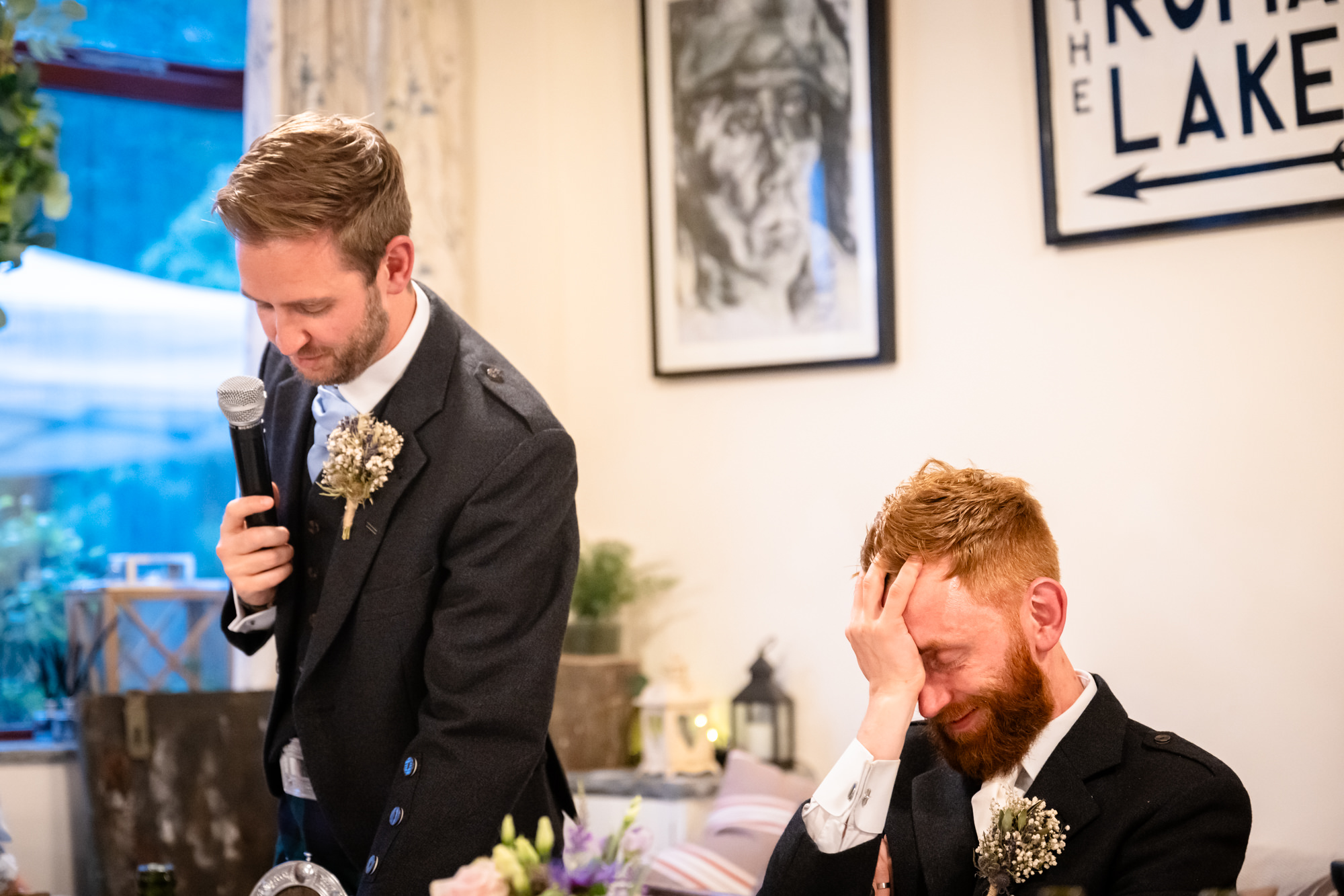 groom looking embarrassed during the speeches at The Roman Lakes