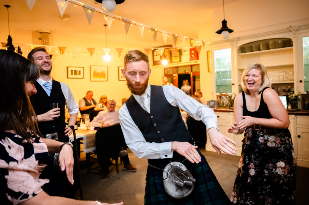 Groom dancing at The Roman Lakes