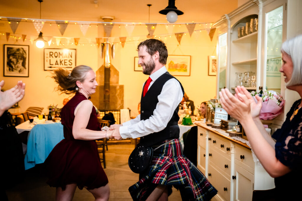 Scottish man ceilidh dancing at The Roman Lakes 