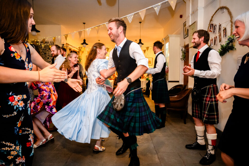 Ceilidh dance spinning at The Roman Lakes