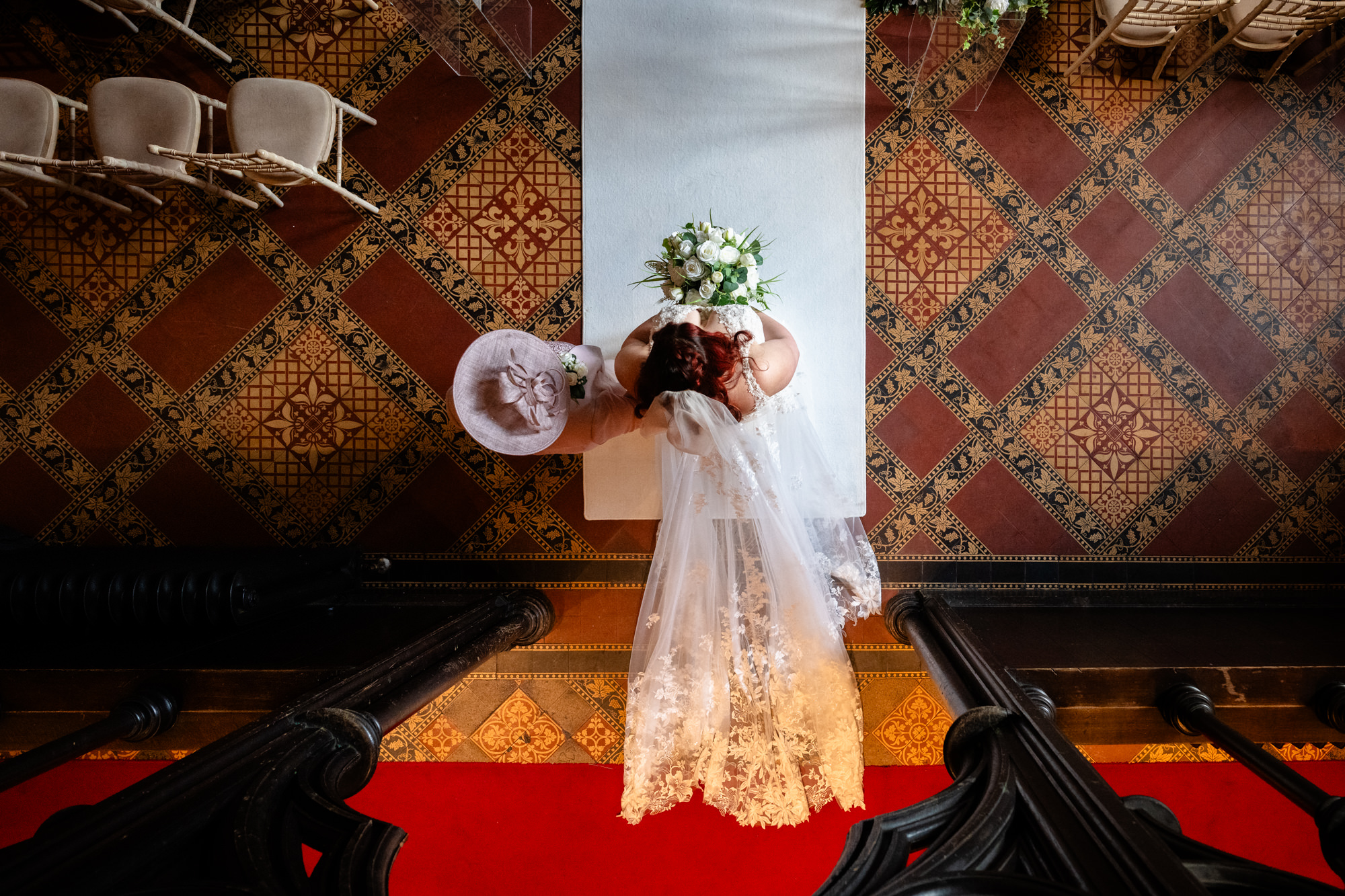 Bride walking down the aisle at Peckforton Castle