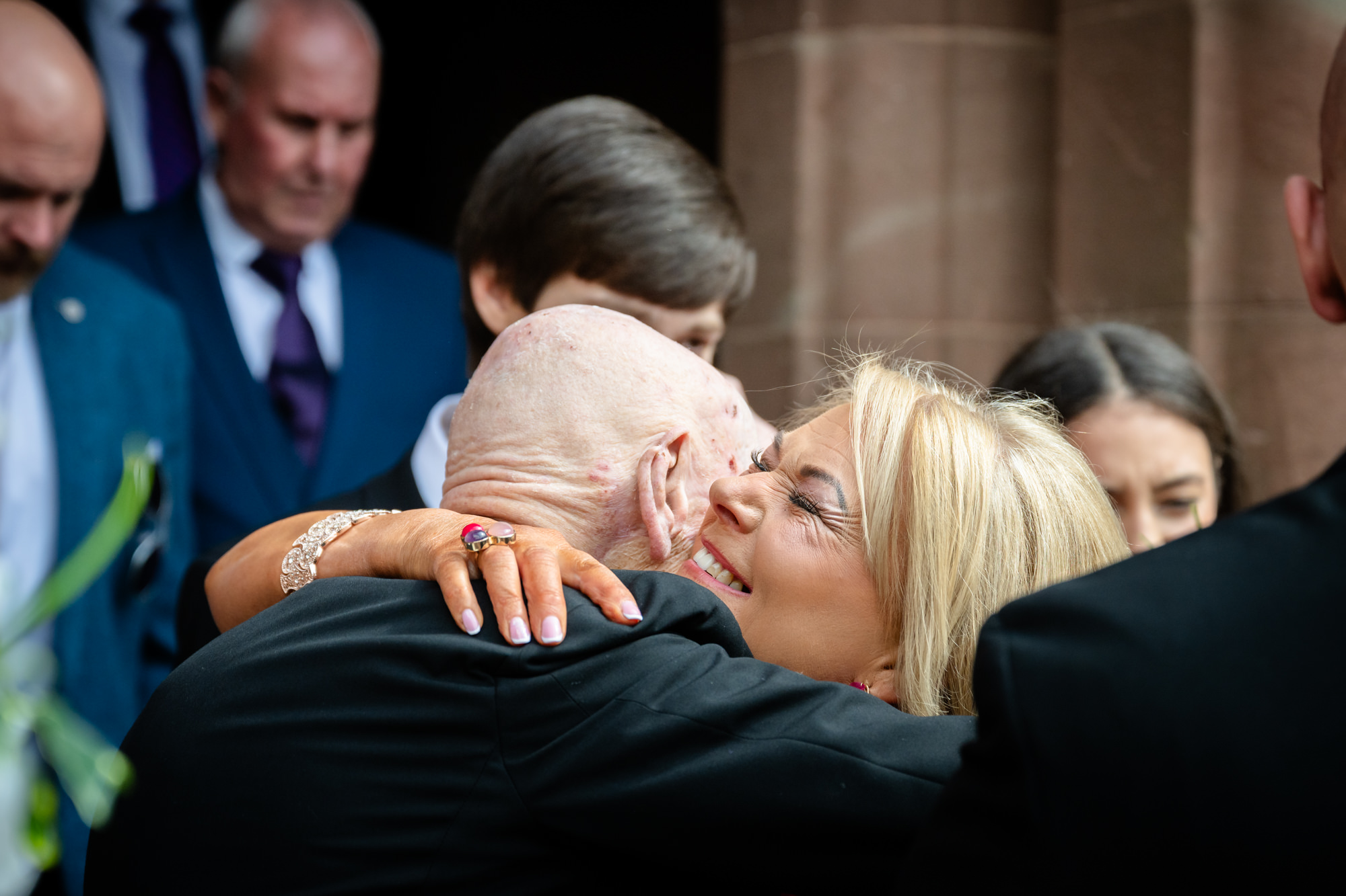 guests hugging at Peckforton Castle