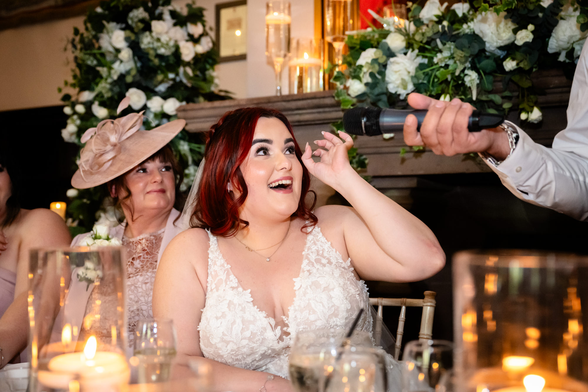 Bride laughing during the speeches at Peckforton Castle