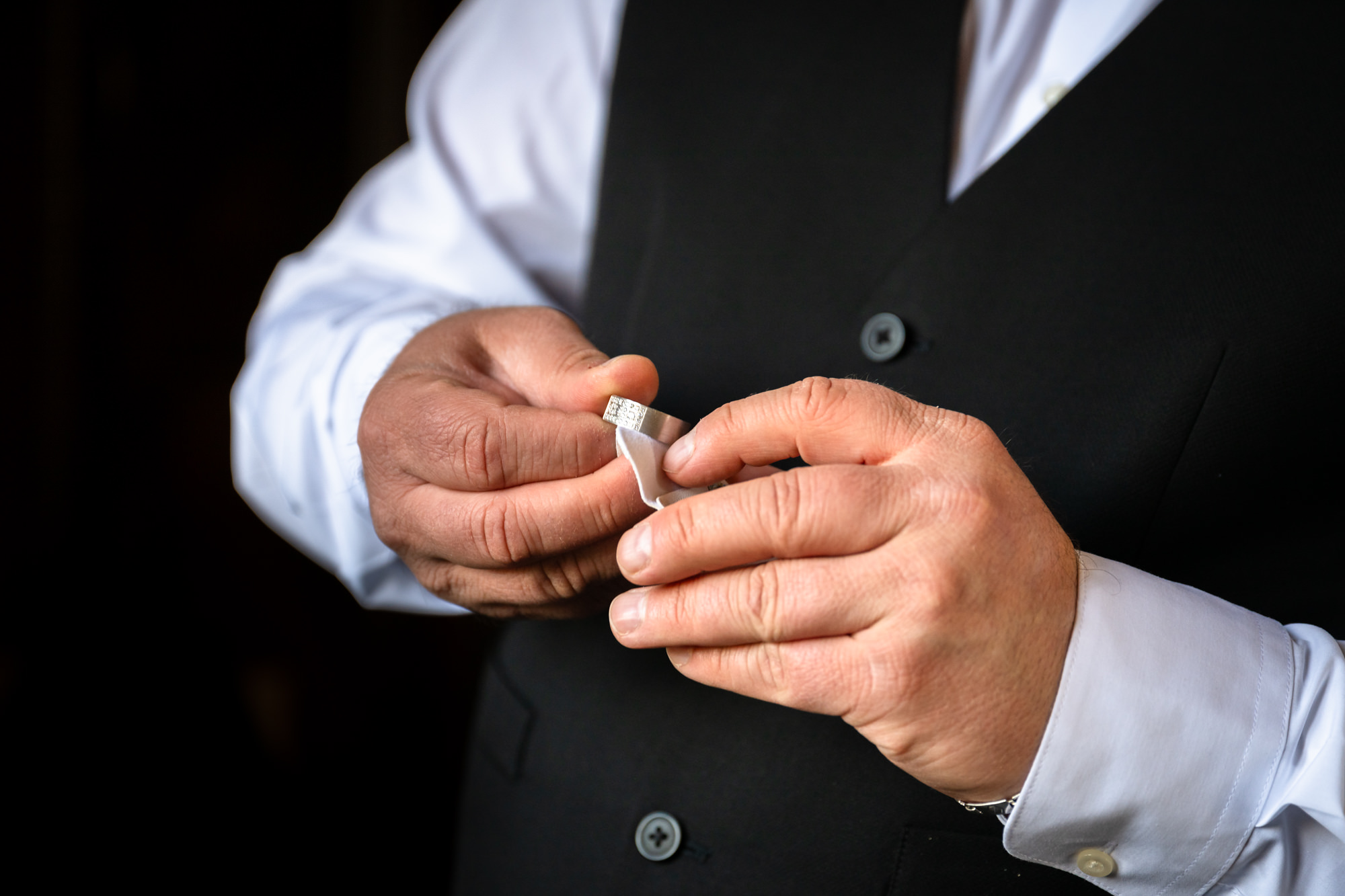 Groom checking his ring before the ceremony at Peckforton Castle