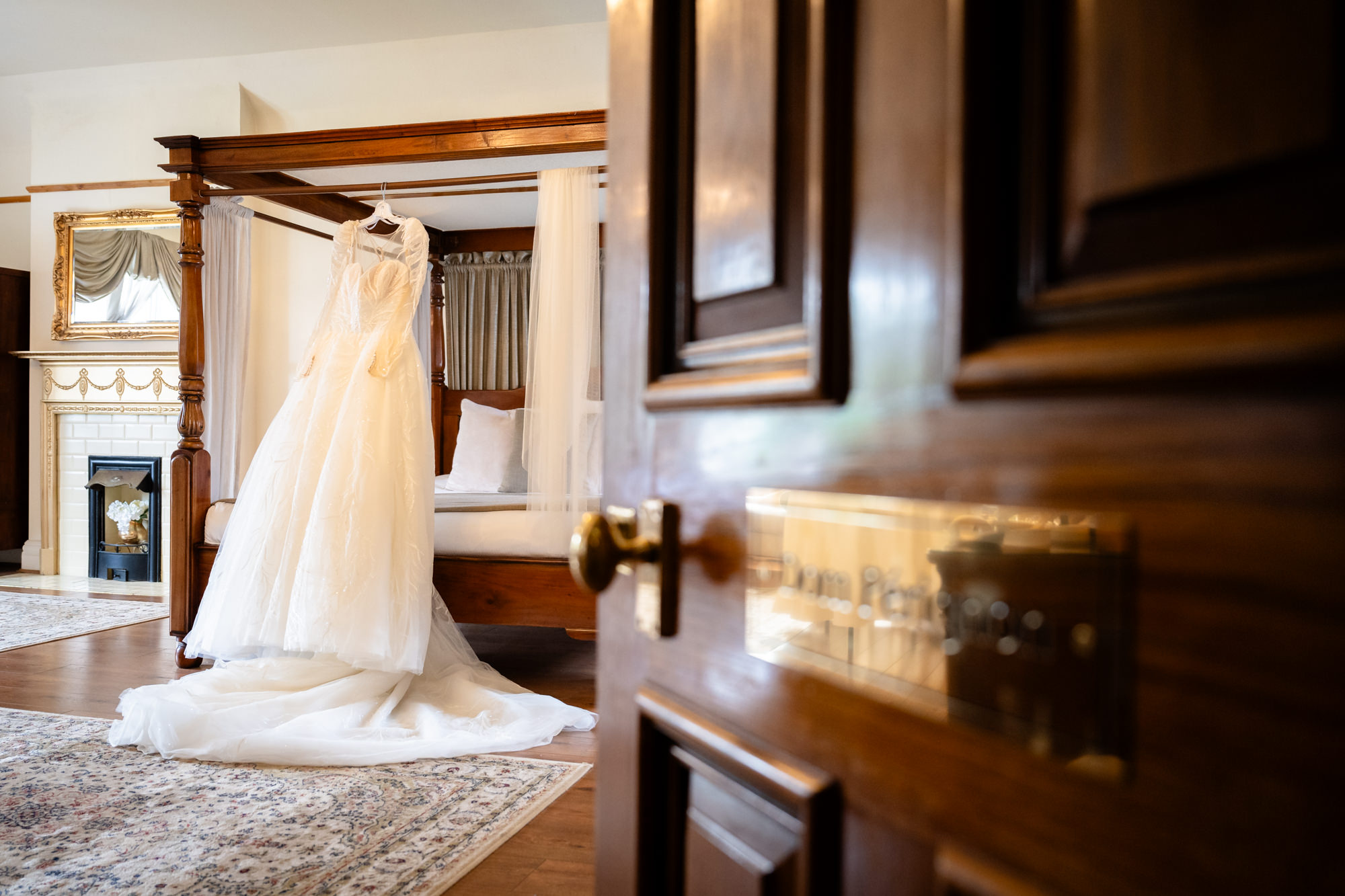 Wedding fress hanging on the bed in the bridal Suite at West Tower