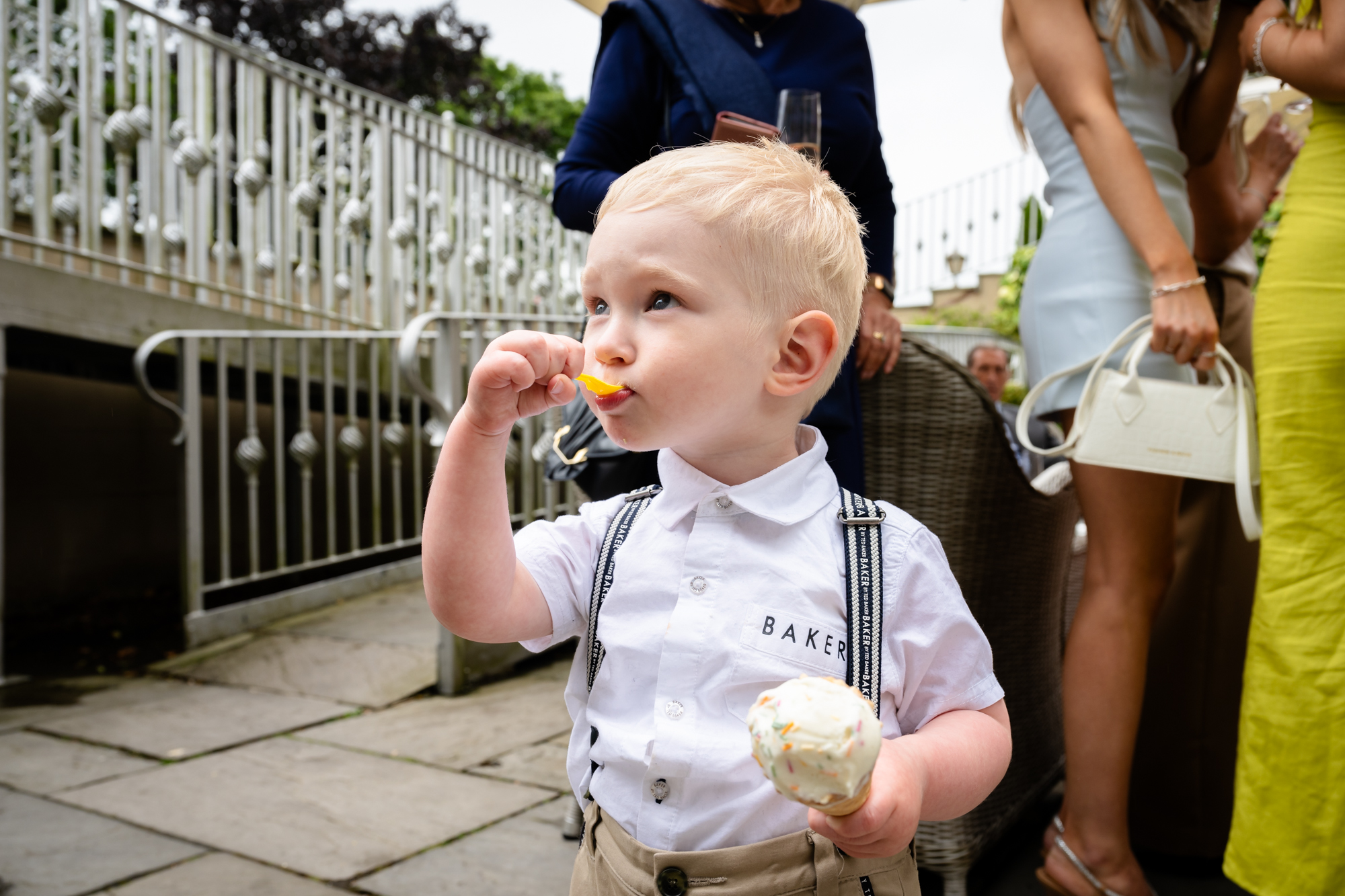 Child eating an ice cream with a scoop at West Tower