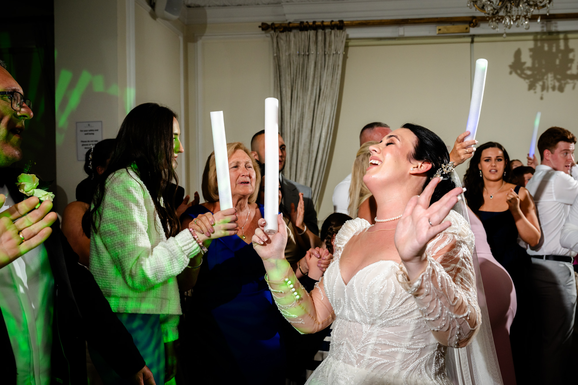 Bride dancing with a flashing stick