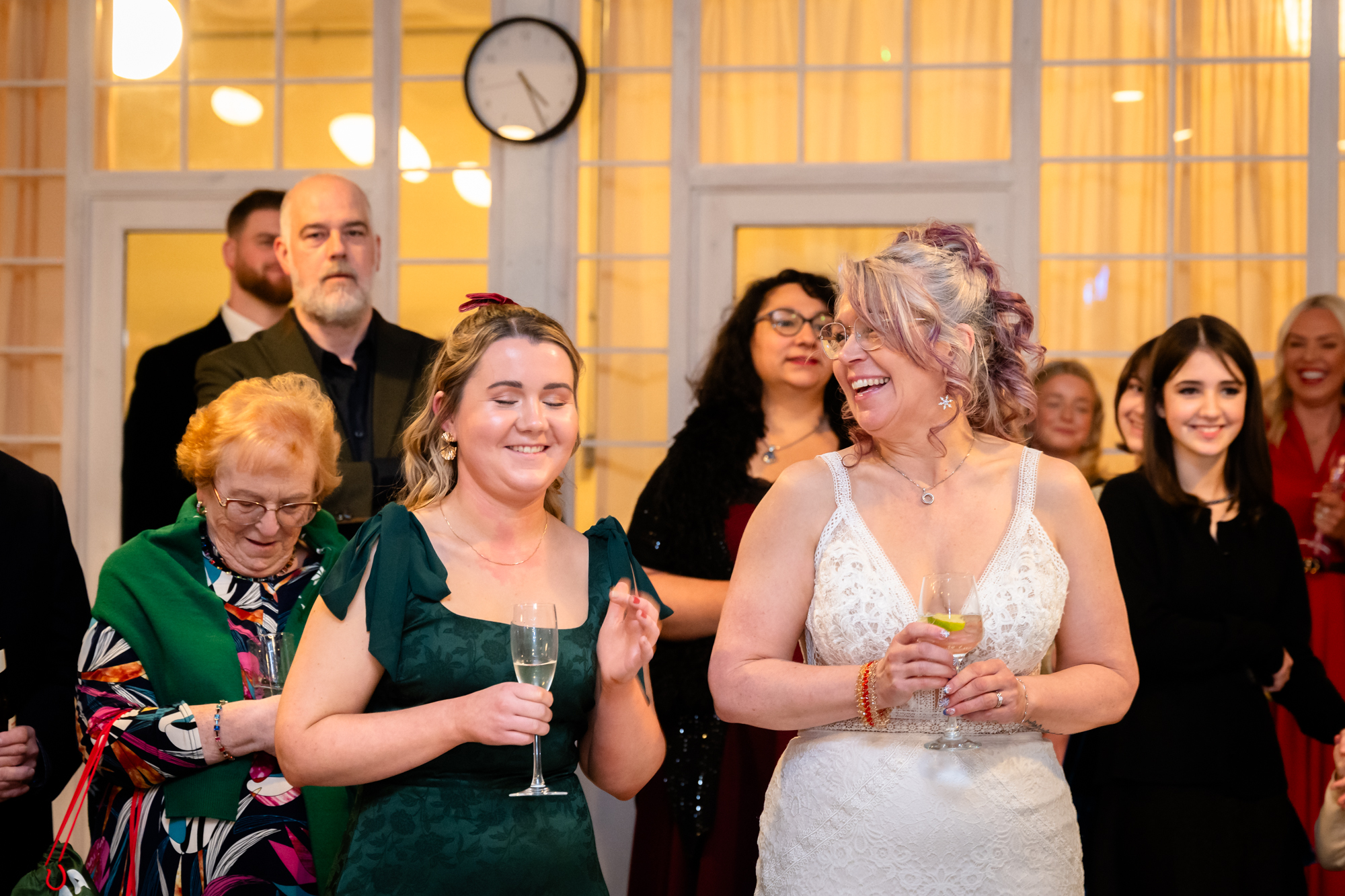 Bride and Daughter reacting to the groom's speech at Fabric Studio 