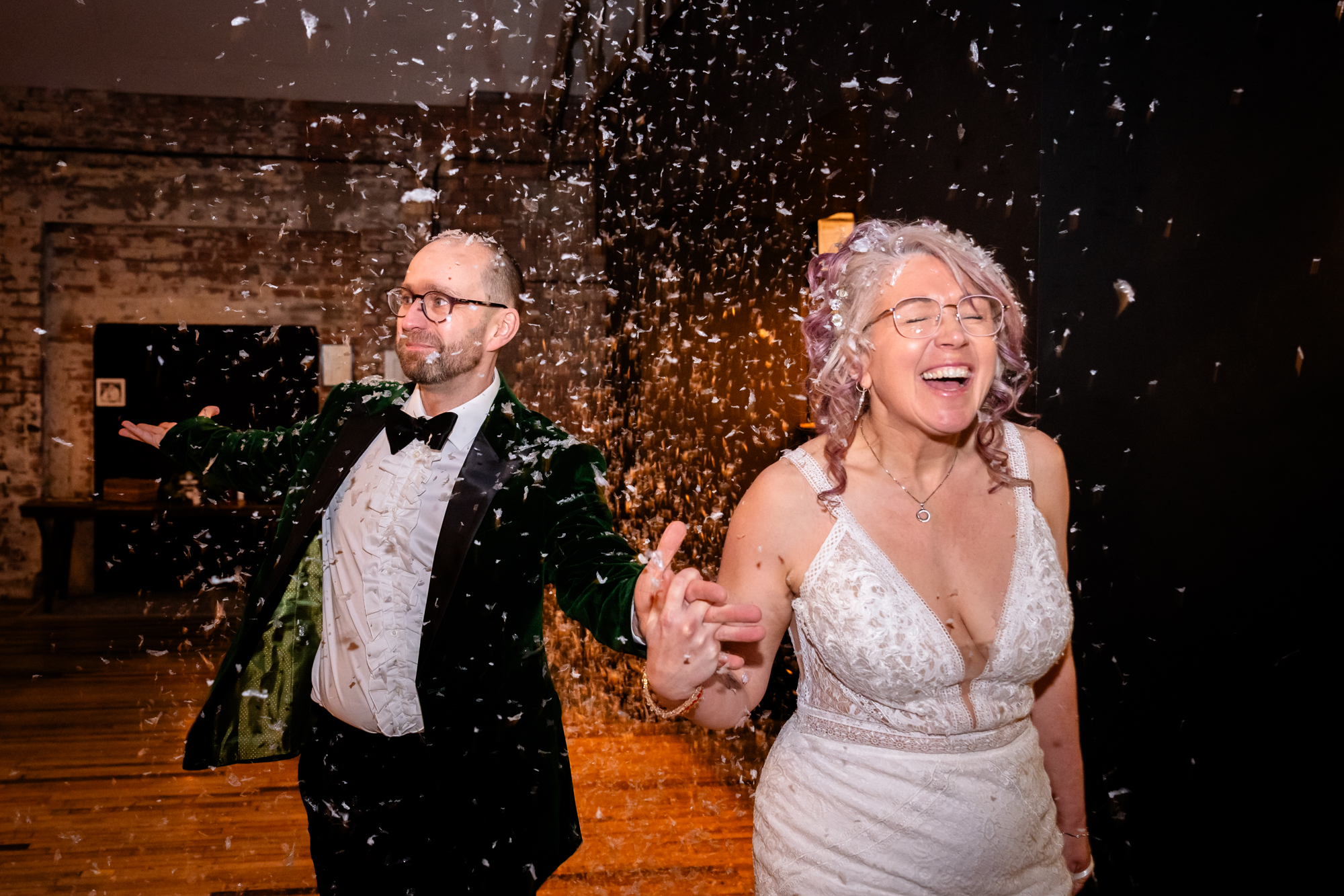 Bride and groom walking in the room with fake Snow at Scale