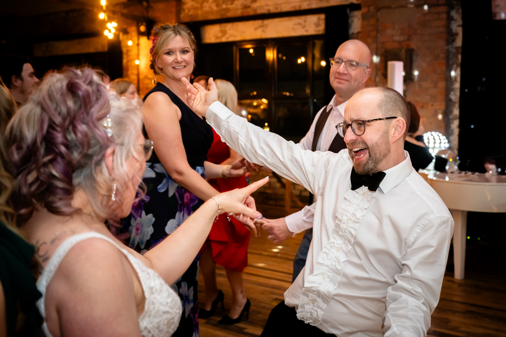 Groom dancing with the brideat Scale