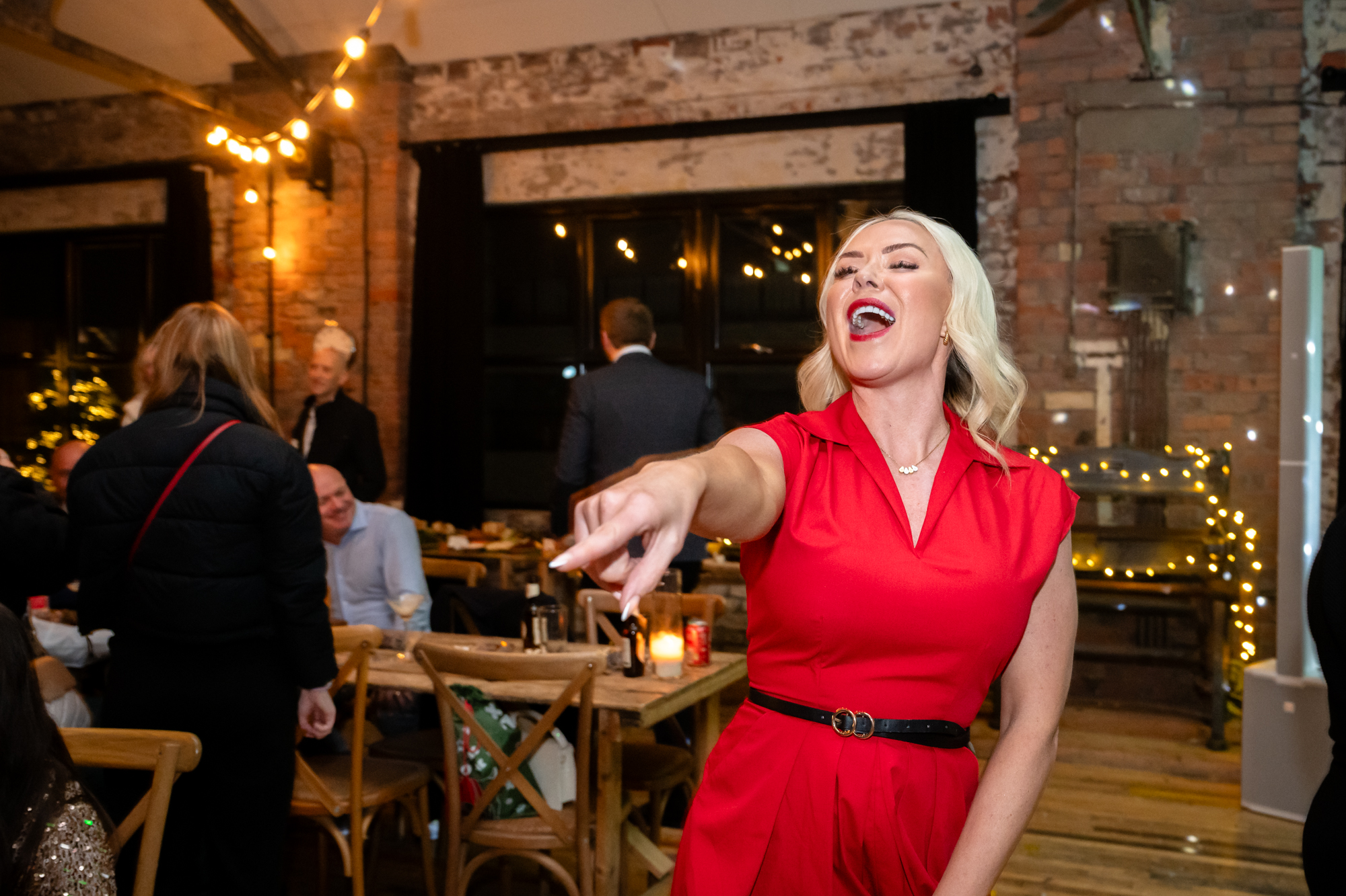 Woman dancing and pointing with her fingerat Scale