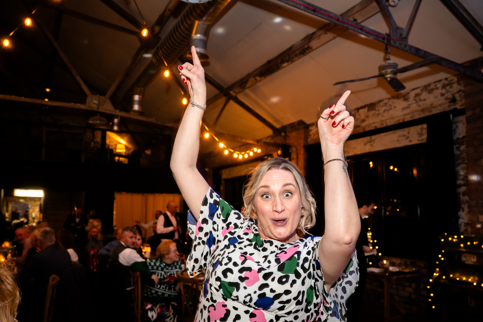 Woman dancing with two fingers in the air