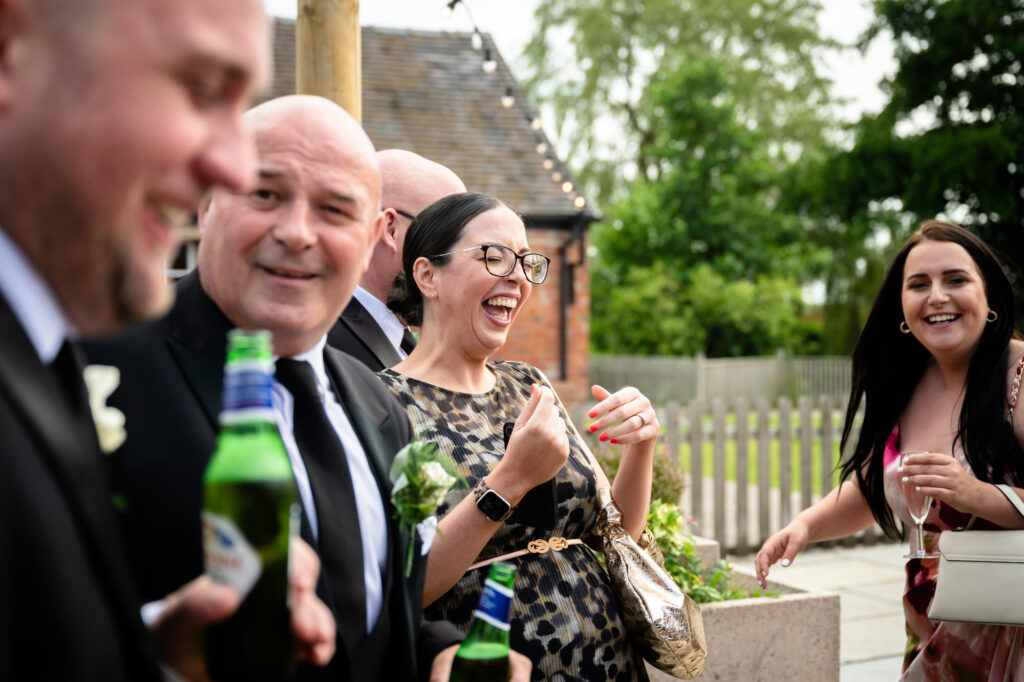 guest laughing during the confetti at Hanbury Barns