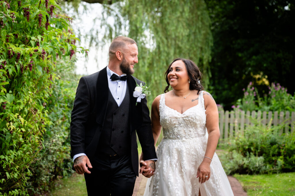 Bride and groom in the gardens at Hanbury Barns