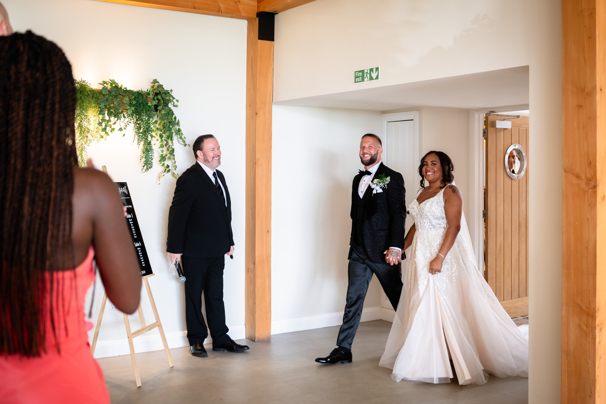 Bride and room entering the wedding breakfast room