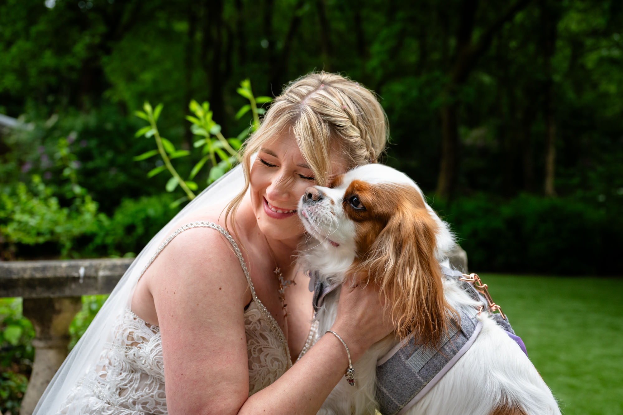 The bride kissing her dog