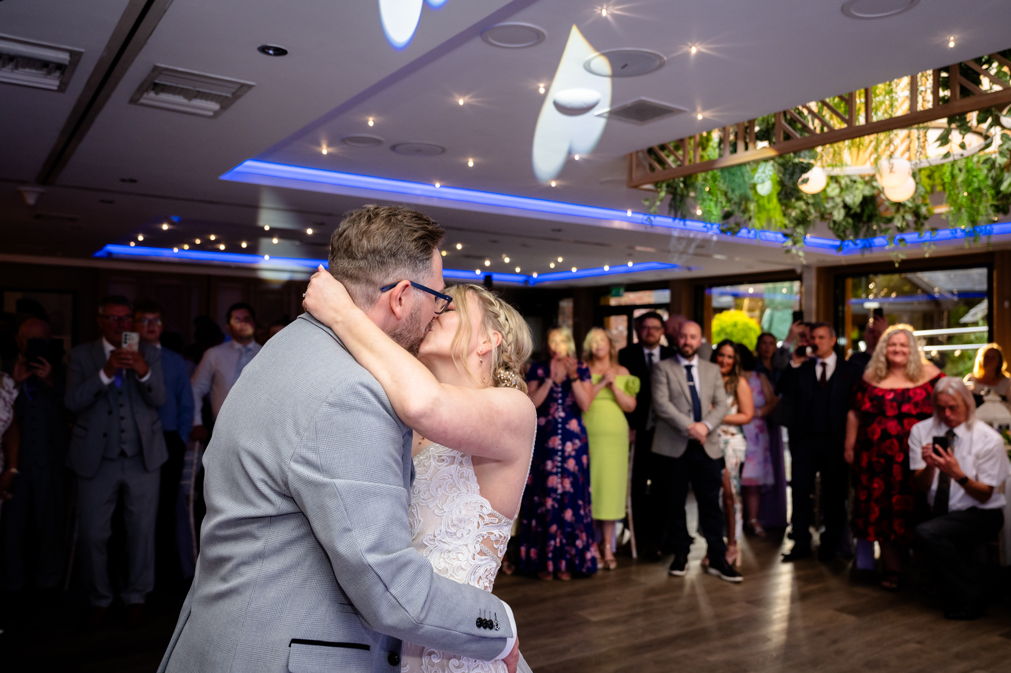 Bride and groom kissing on the dancefloor