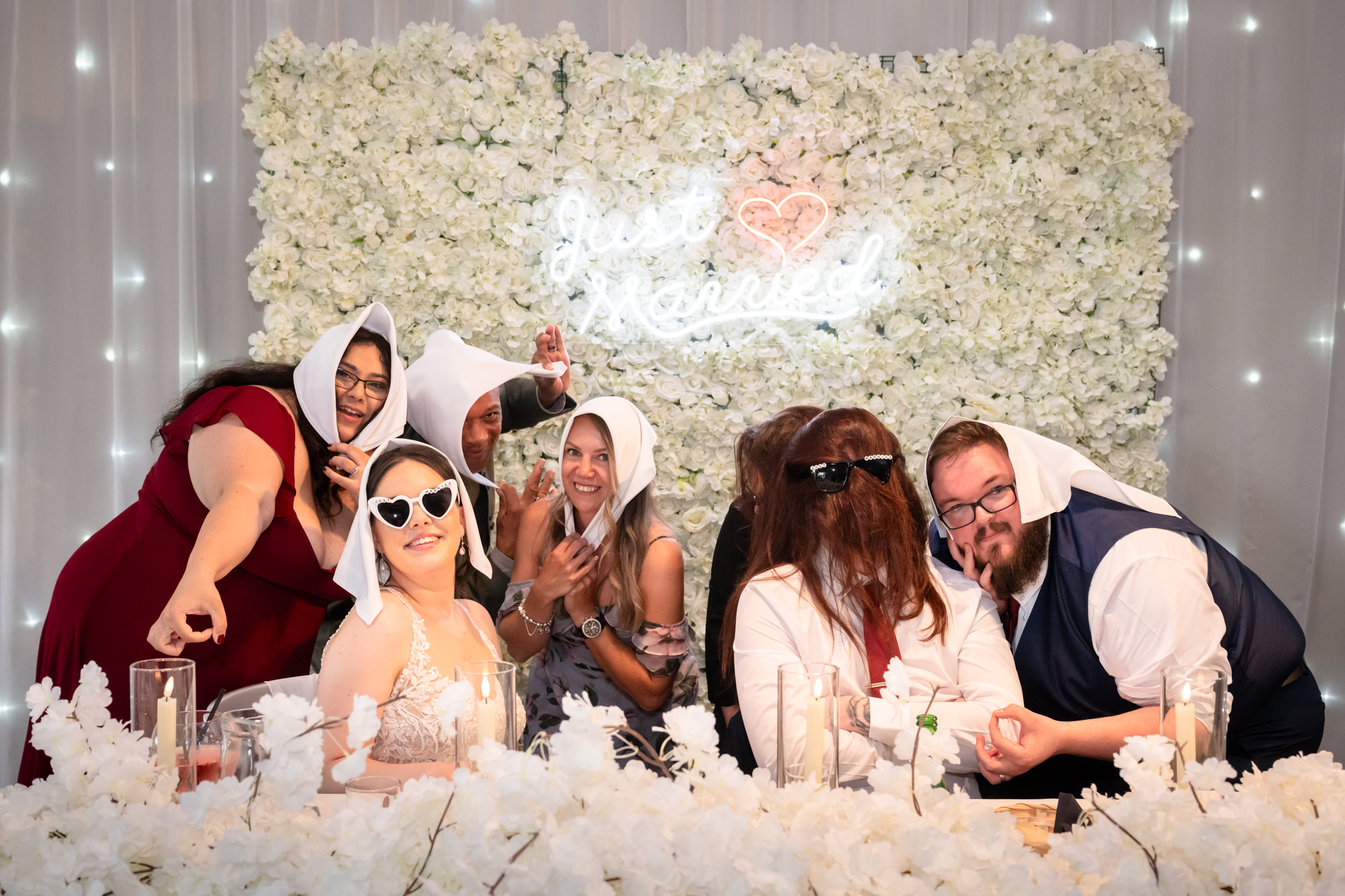 A lively dash photo of the bride and groom and a group of friends at Heaton House Farm.