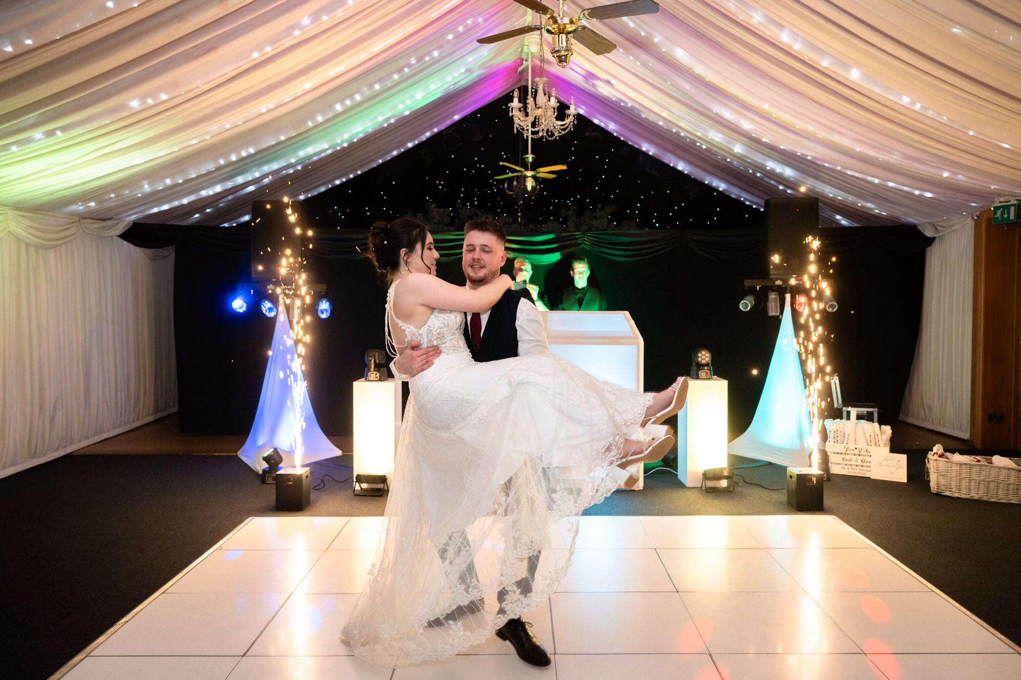 The bride and groom are captured mid-dance during their first dance at Heaton House Farm.