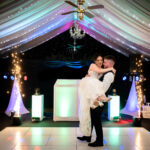 A beautiful shot of the groom lifting his new wife up during their first dance at Heaton House Farm.