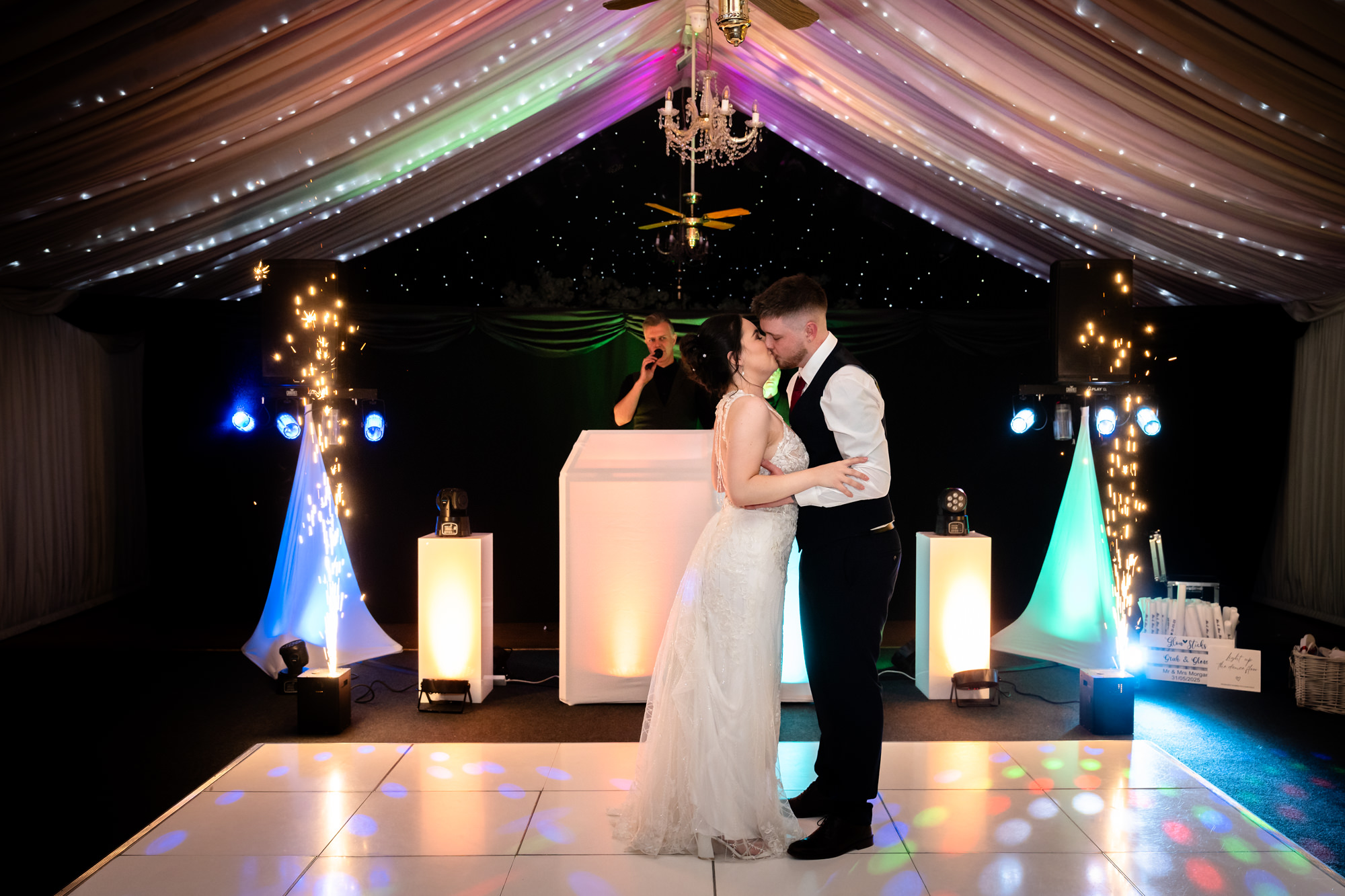 The bride and groom embrace as they finish their first dance at Heaton House Farm.