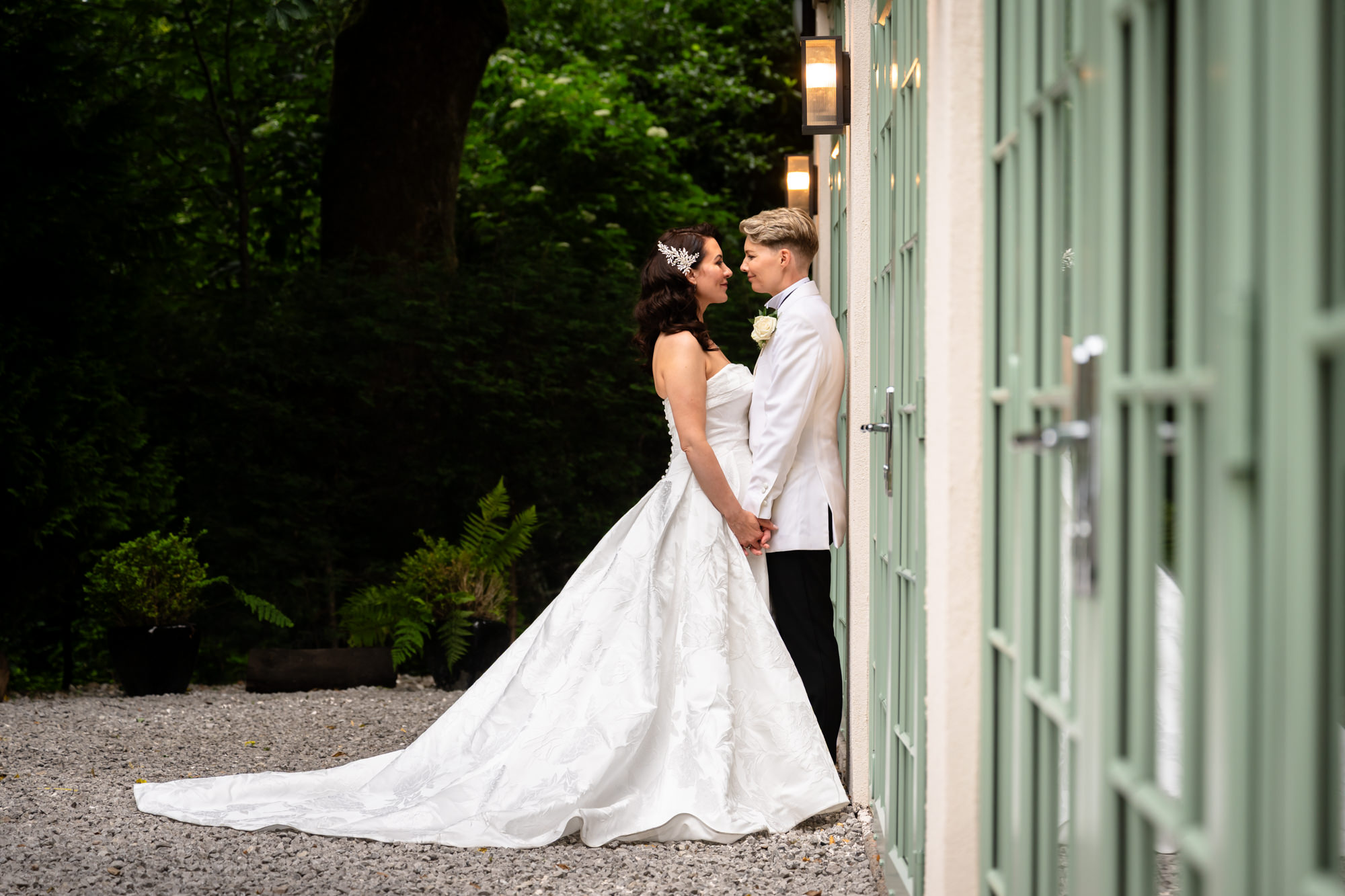 A portrait of the two brides embracing each other at Springbank Manor.