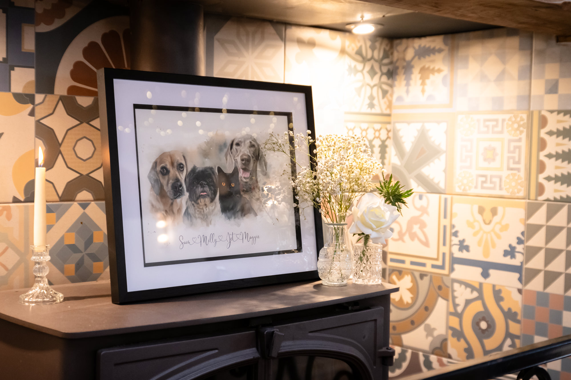 A hand drawing of the groom's dogs in a frame