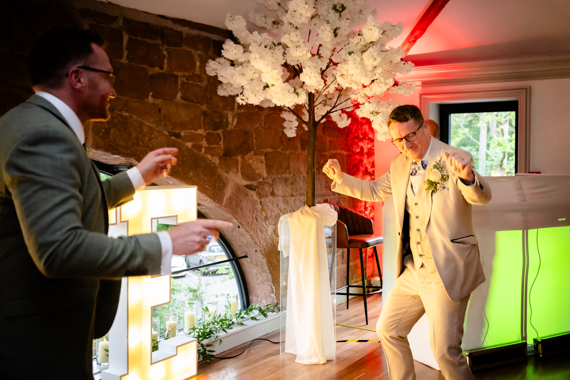 The grooms dancing together during their first dance.
