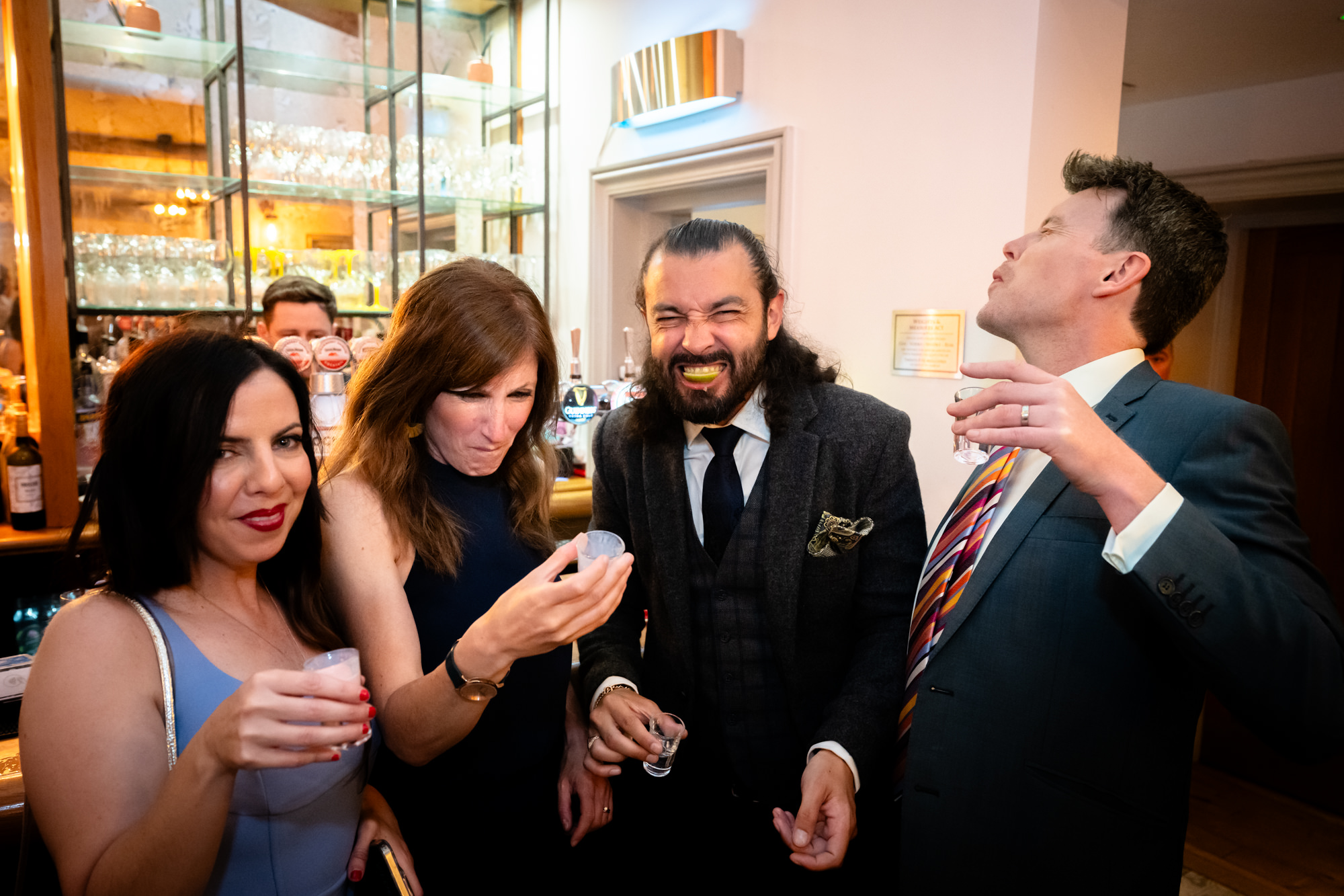 A group of guests drinking shots