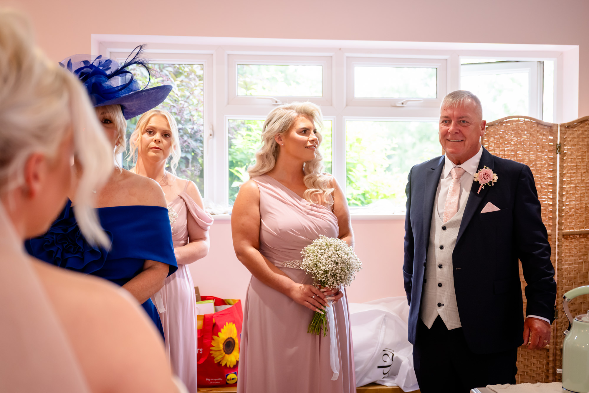 The bride's father seeing his daughter for the first time in her dress.