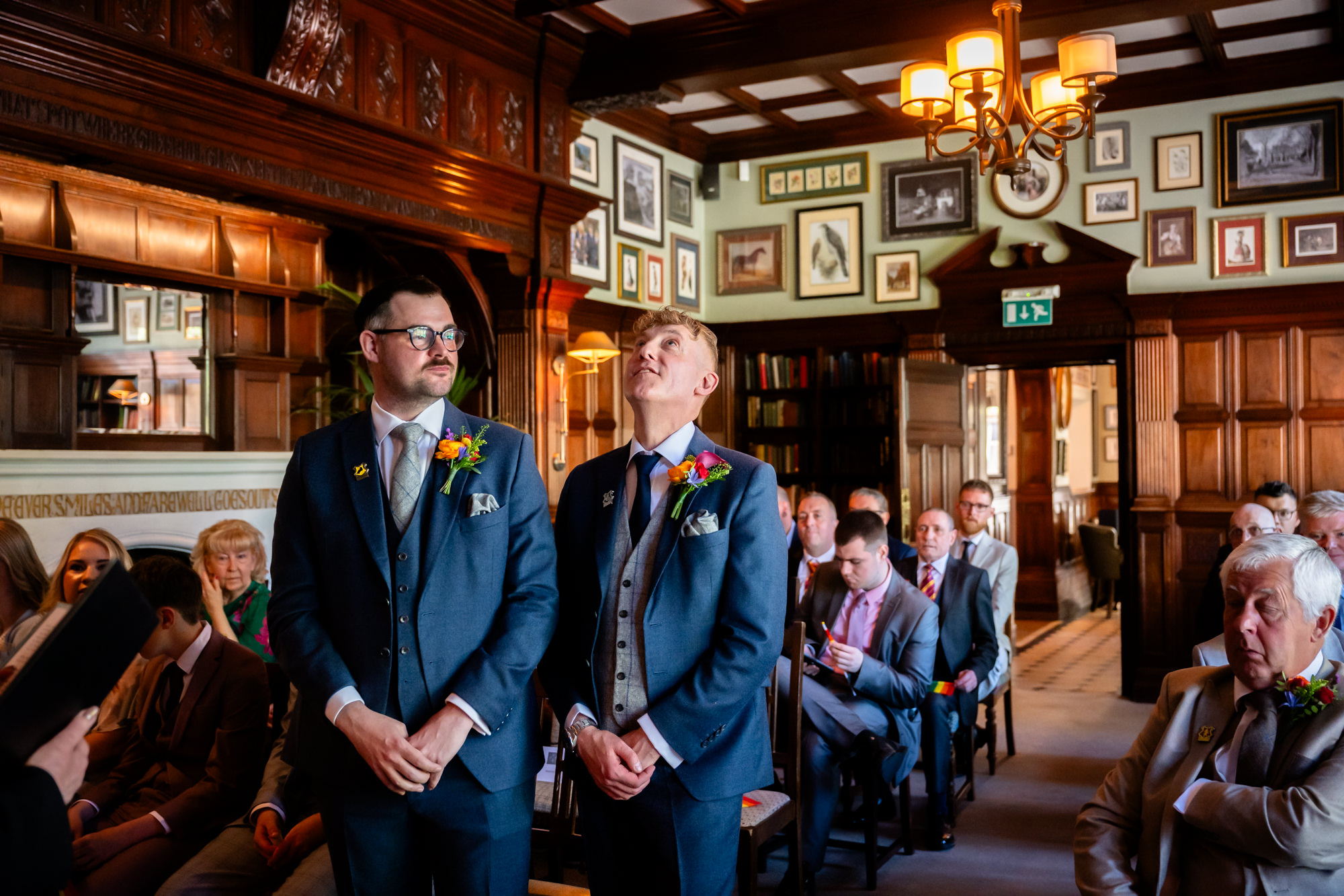Marc waits at the front of the ceremony room at The Oakfield with a best man.